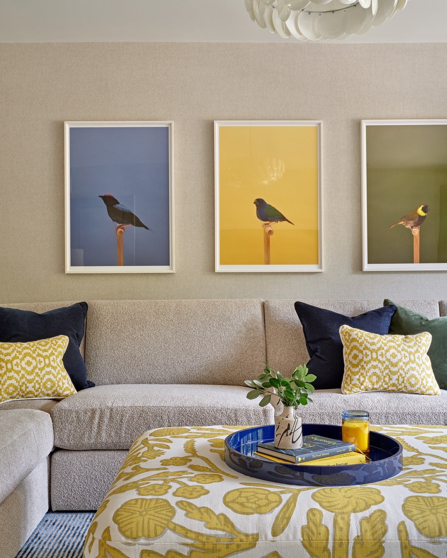 4. Subtle Gray Sectional with Yellow Graphic Accents (Yellow and Gray Living Room Ideas)