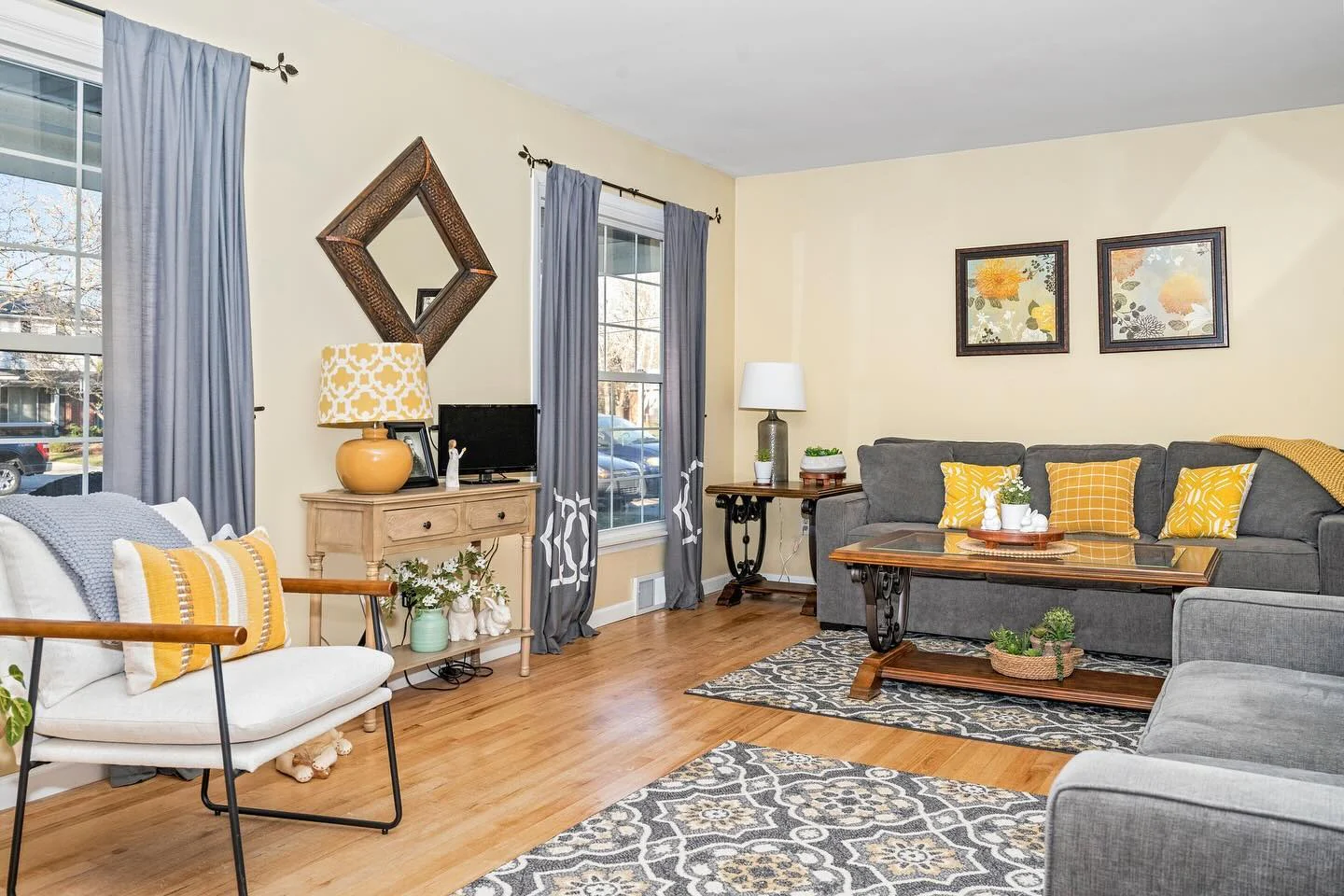 7. Light Gray Sofas with Sunny Throw Pillows (Yellow and Gray Living Room Ideas)