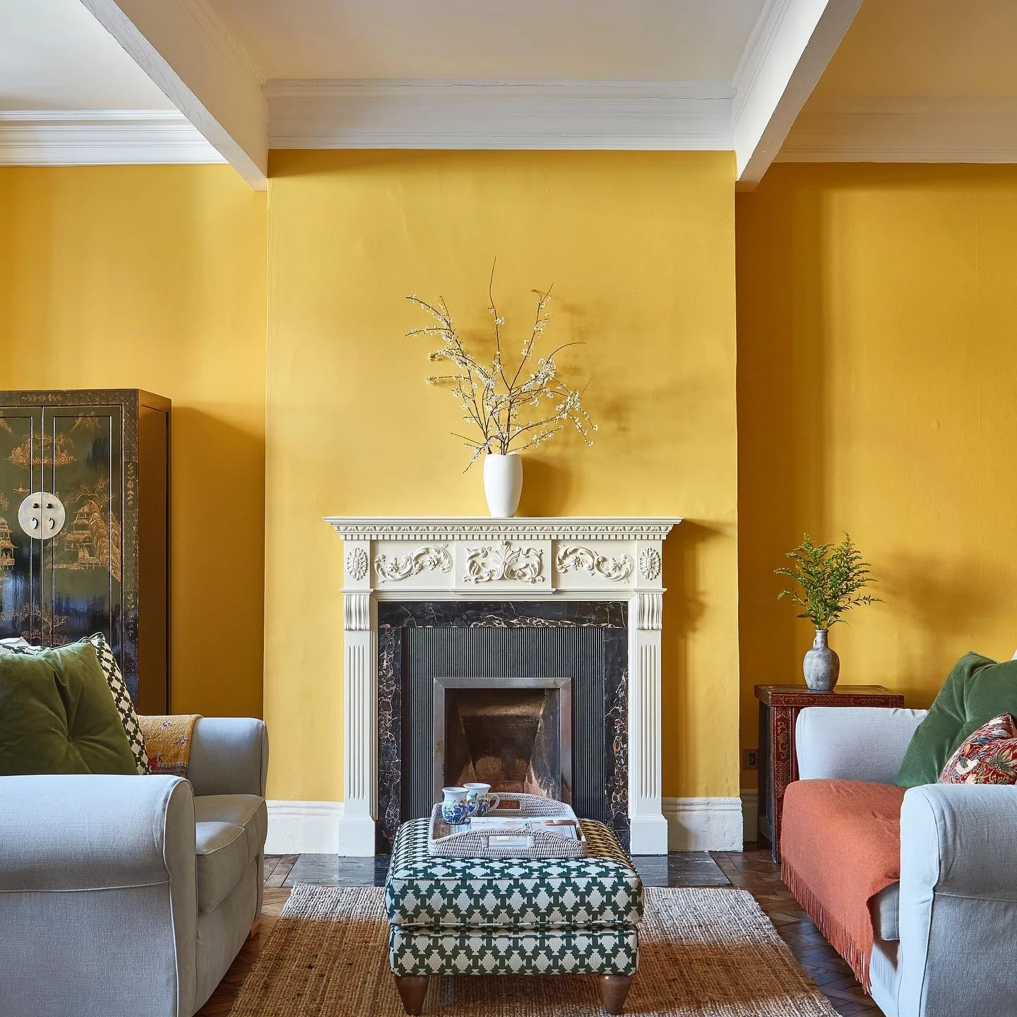 6. Statement Yellow Fireplace with Tailored Gray Chairs (Yellow and Gray Living Room Ideas)