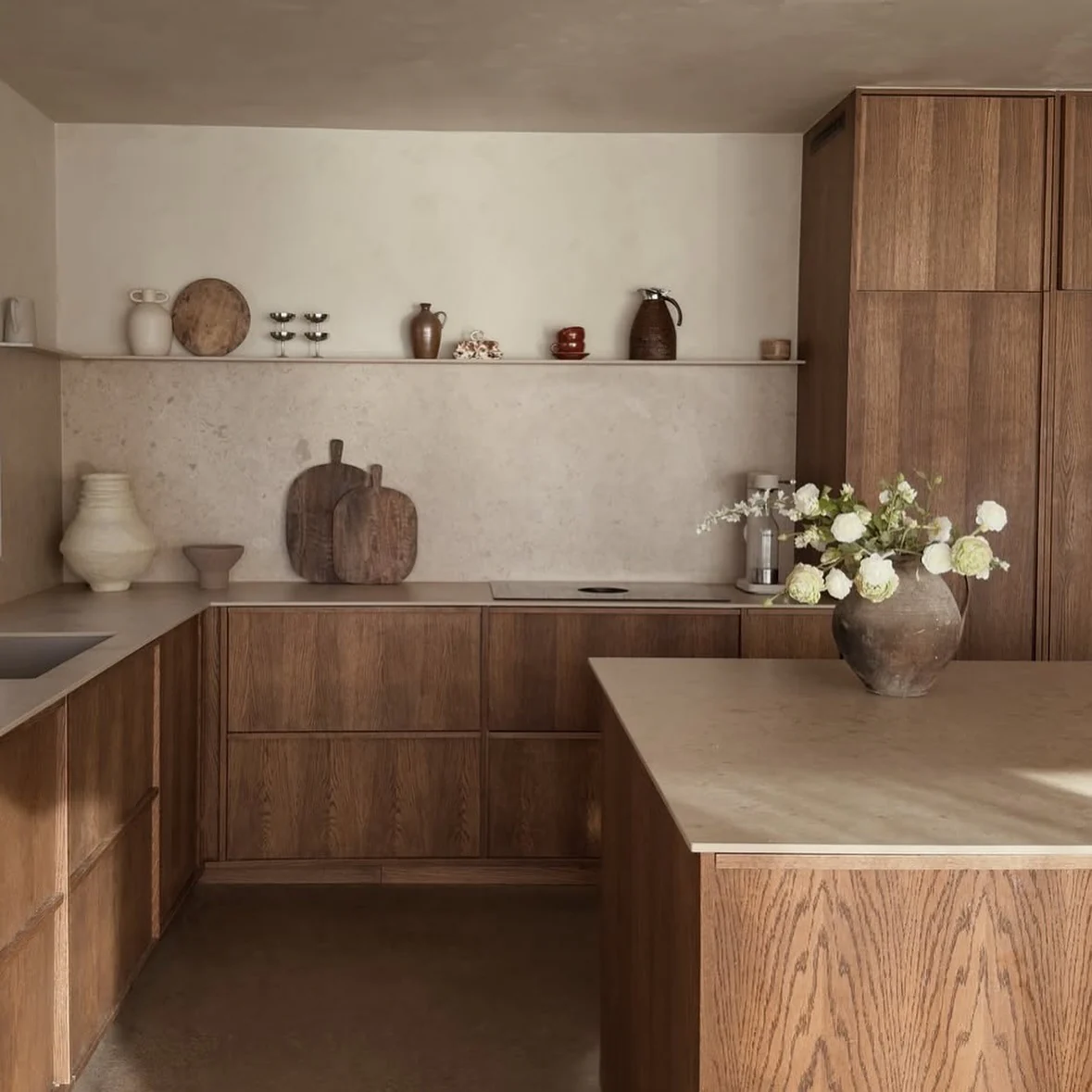 2. Earth-Toned Oak Kitchen with Limestone Backdrop (Japanese Style Kitchen Ideas)