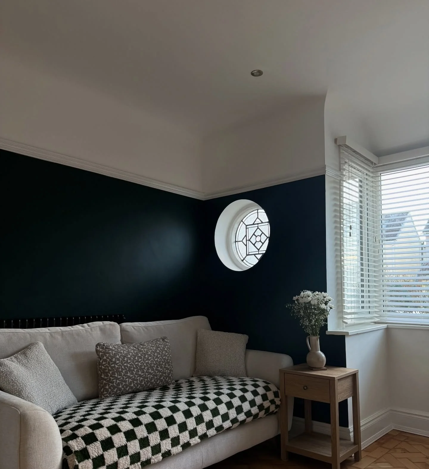 6. Deep Charcoal Feature Wall with Graphic Impact (Empty Wall Ideas for Living Room)