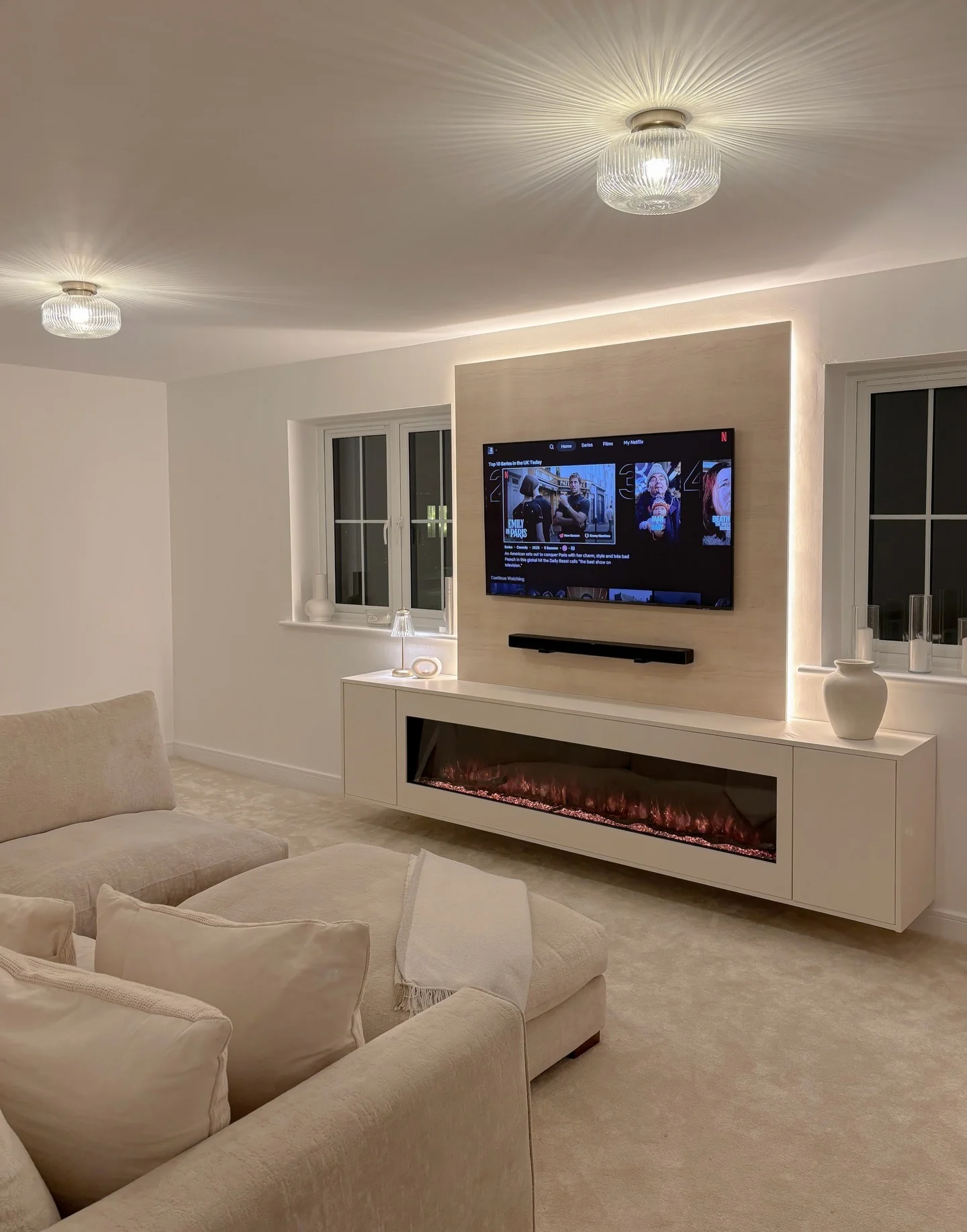 7. Warm Backlit TV Wall in Soft Beige (Empty Wall Ideas for Living Room)