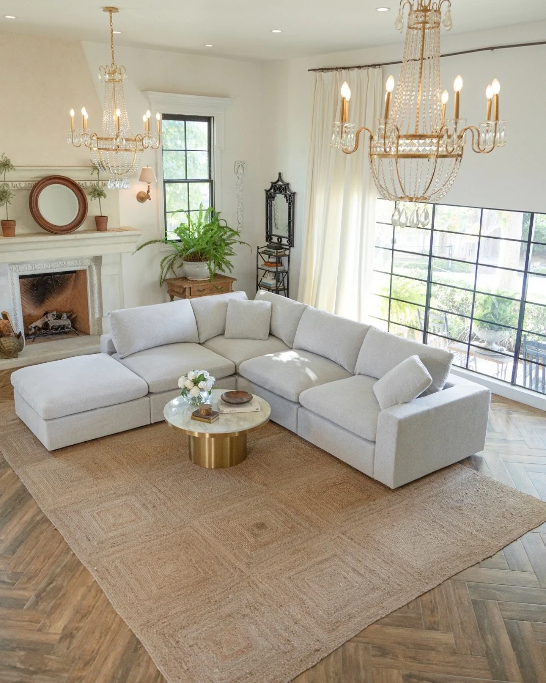 10. Soft White Fireplace Wall with Statement Lighting (Empty Wall Ideas for Living Room)