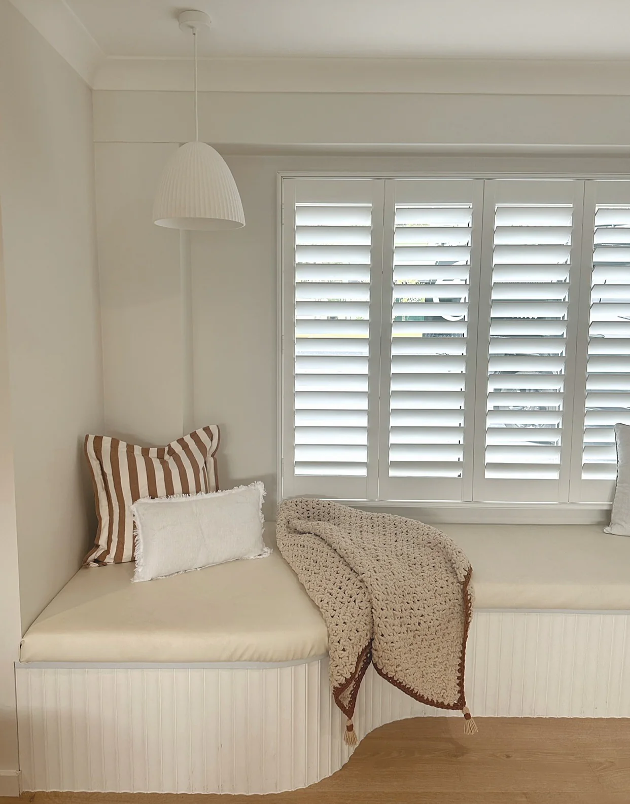 13. Built-In Window Bench for Functional Wall Design (Empty Wall Ideas for Living Room)