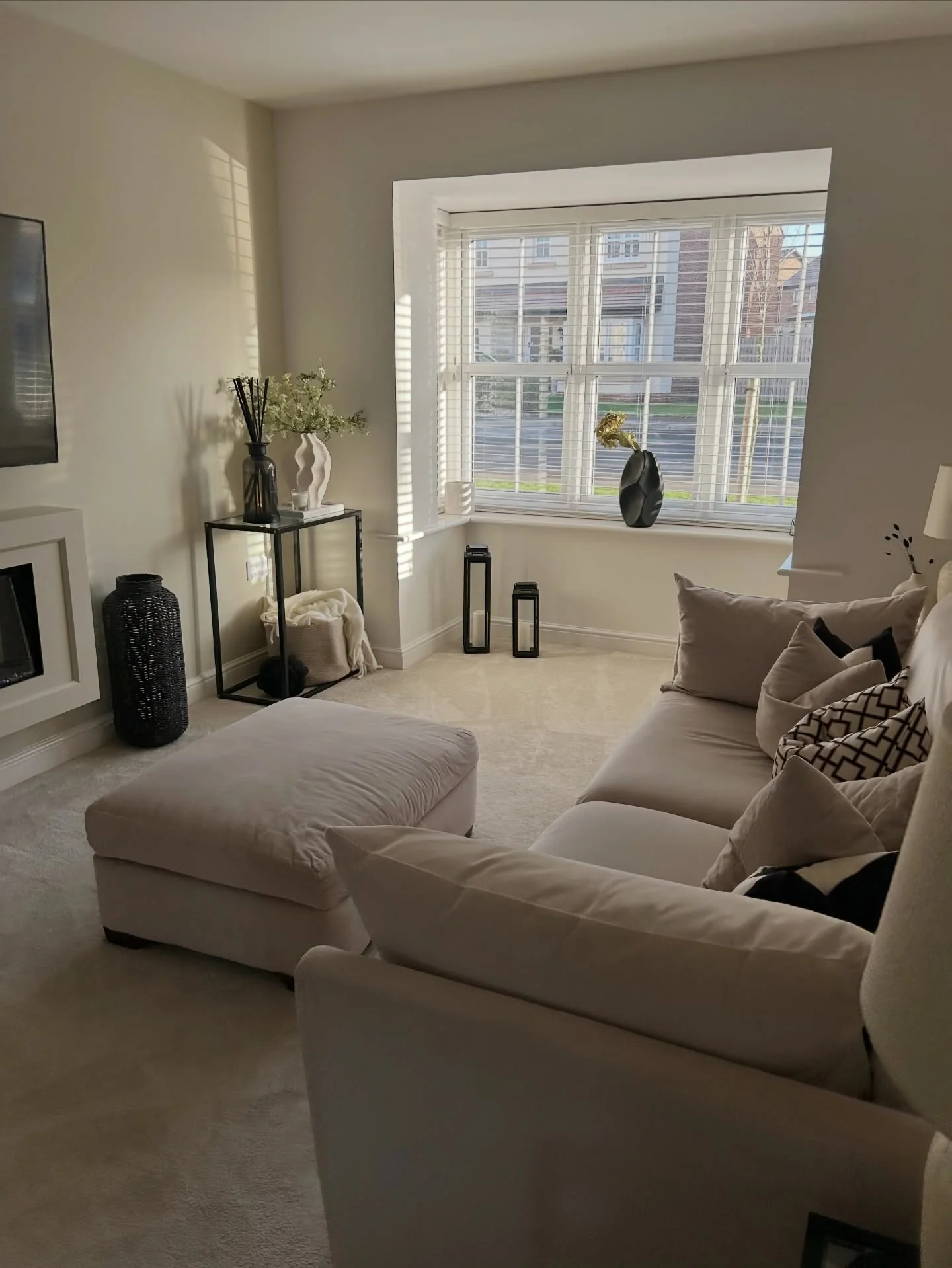 14. Clean Neutral Wall with Minimal Styling (Empty Wall Ideas for Living Room)