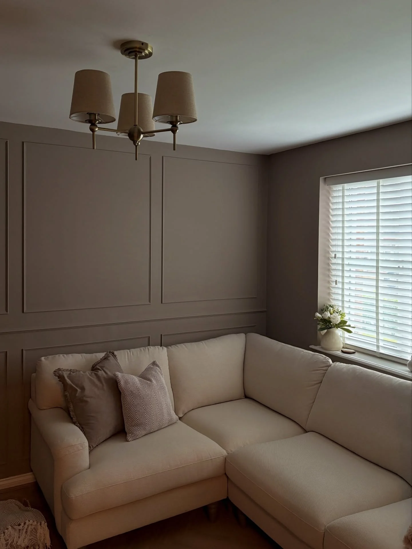 15. Taupe Paneled Wall for Cozy Definition (Empty Wall Ideas for Living Room)