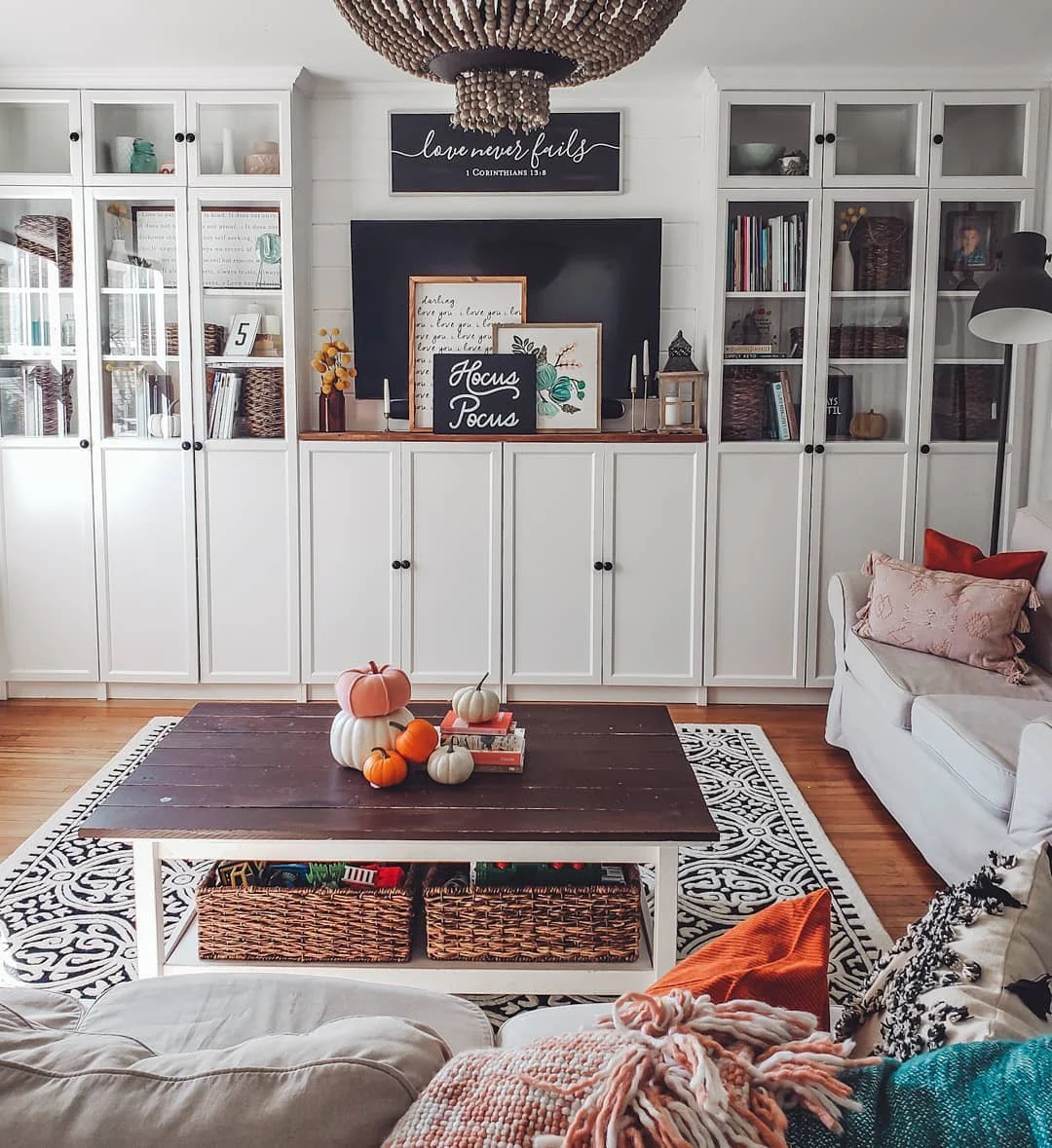 6. Farmhouse Fall Gathering Space in White and Rust (Fall Living Room Decorating Ideas)