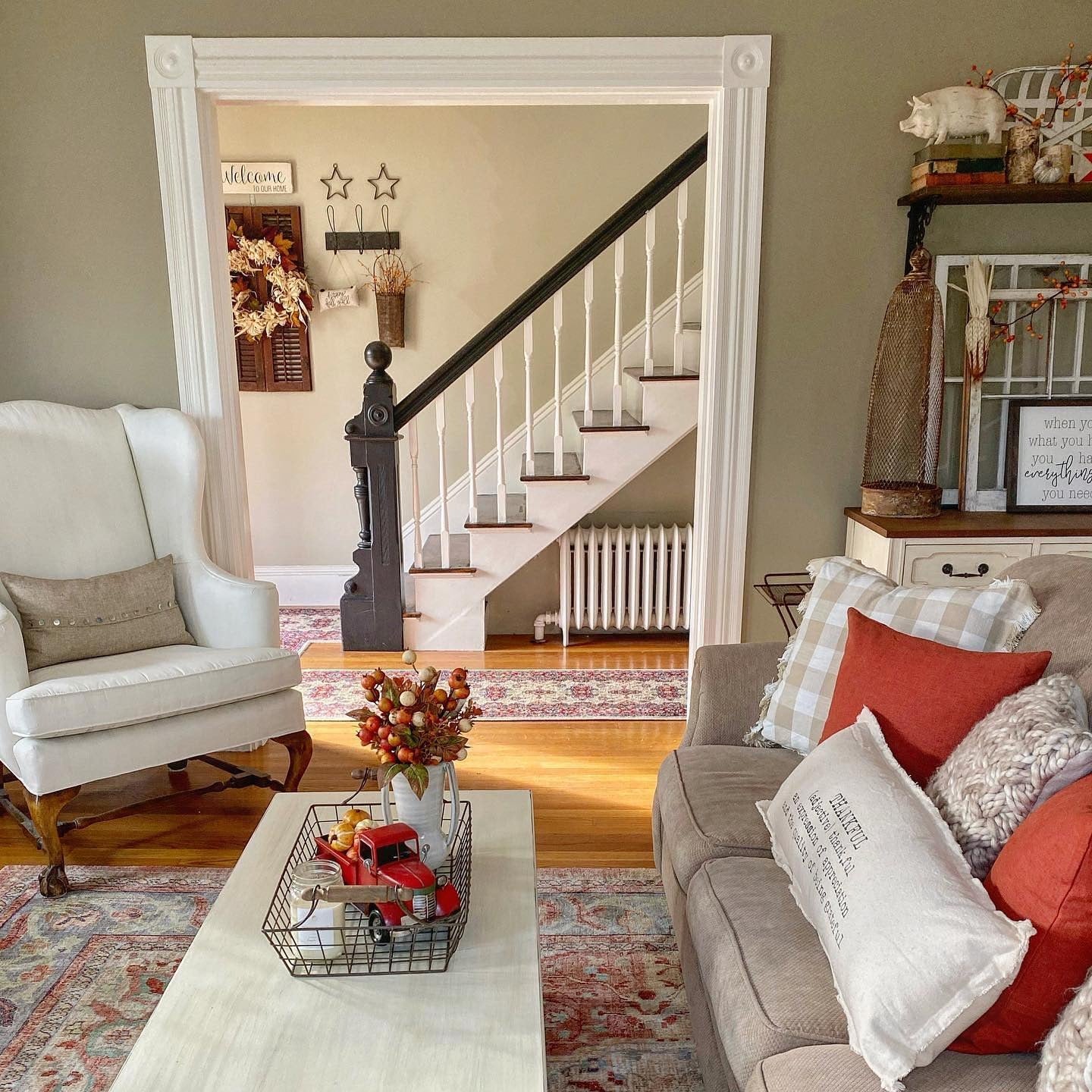 7. Vintage-Inspired Fall Charm in Beige and Cranberry (Fall Living Room Decorating Ideas)