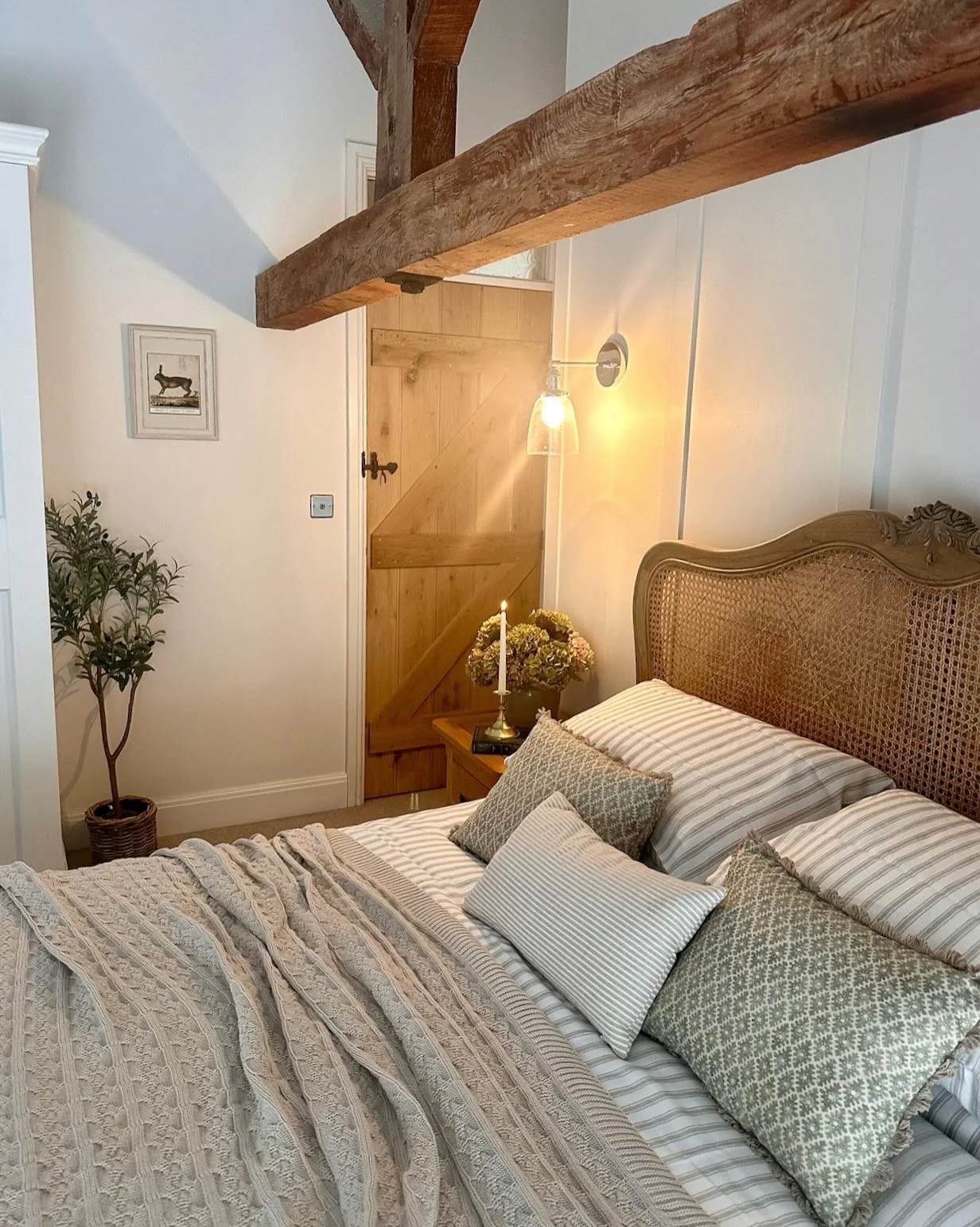 14. Rustic Cottage Bedroom with Cane Headboard and Soft Sage Neutrals (Country Style Bedroom Ideas)