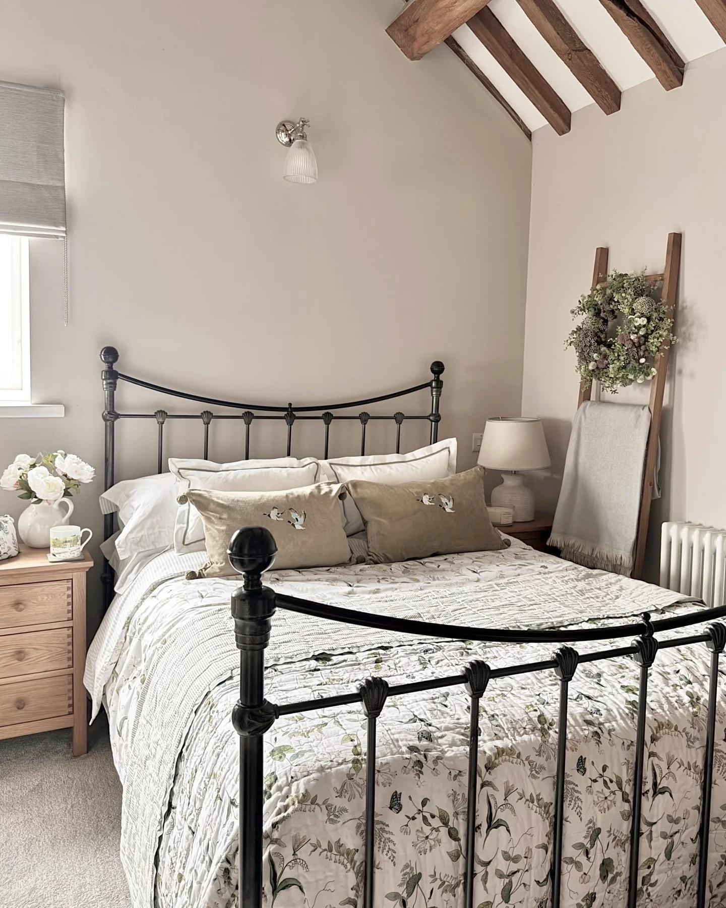 16. Iron Bed Country Bedroom in Soft Beige and Botanical Whites (Country Style Bedroom Ideas)
