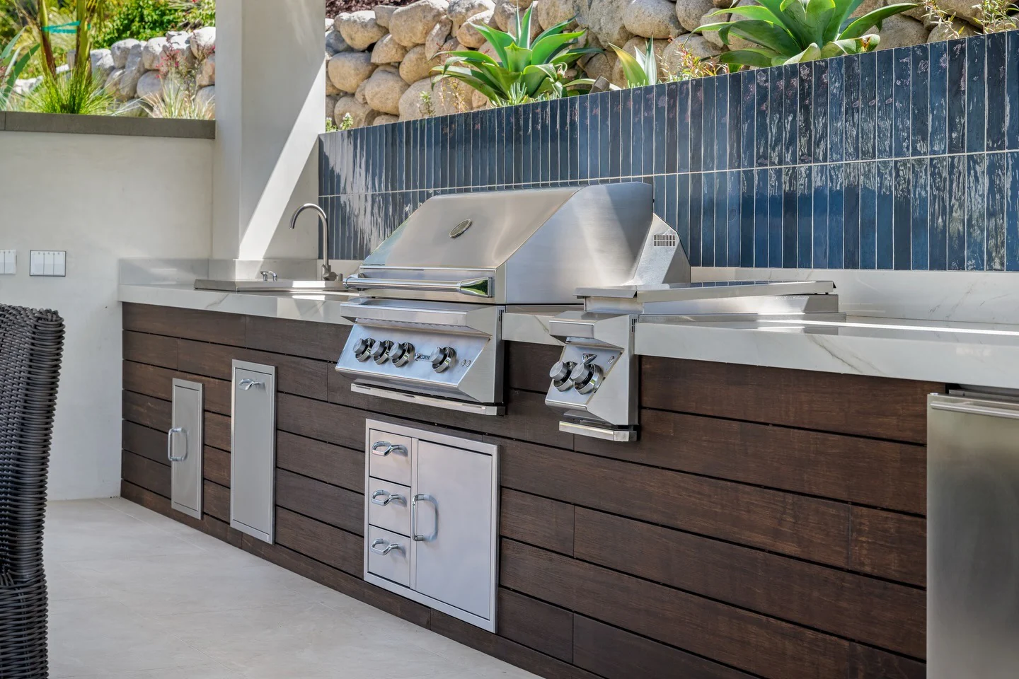 6. Modern Wood-Slat Outdoor Kitchen with White Quartz & Steel Blue Tile (Small Outdoor Kitchen Ideas)