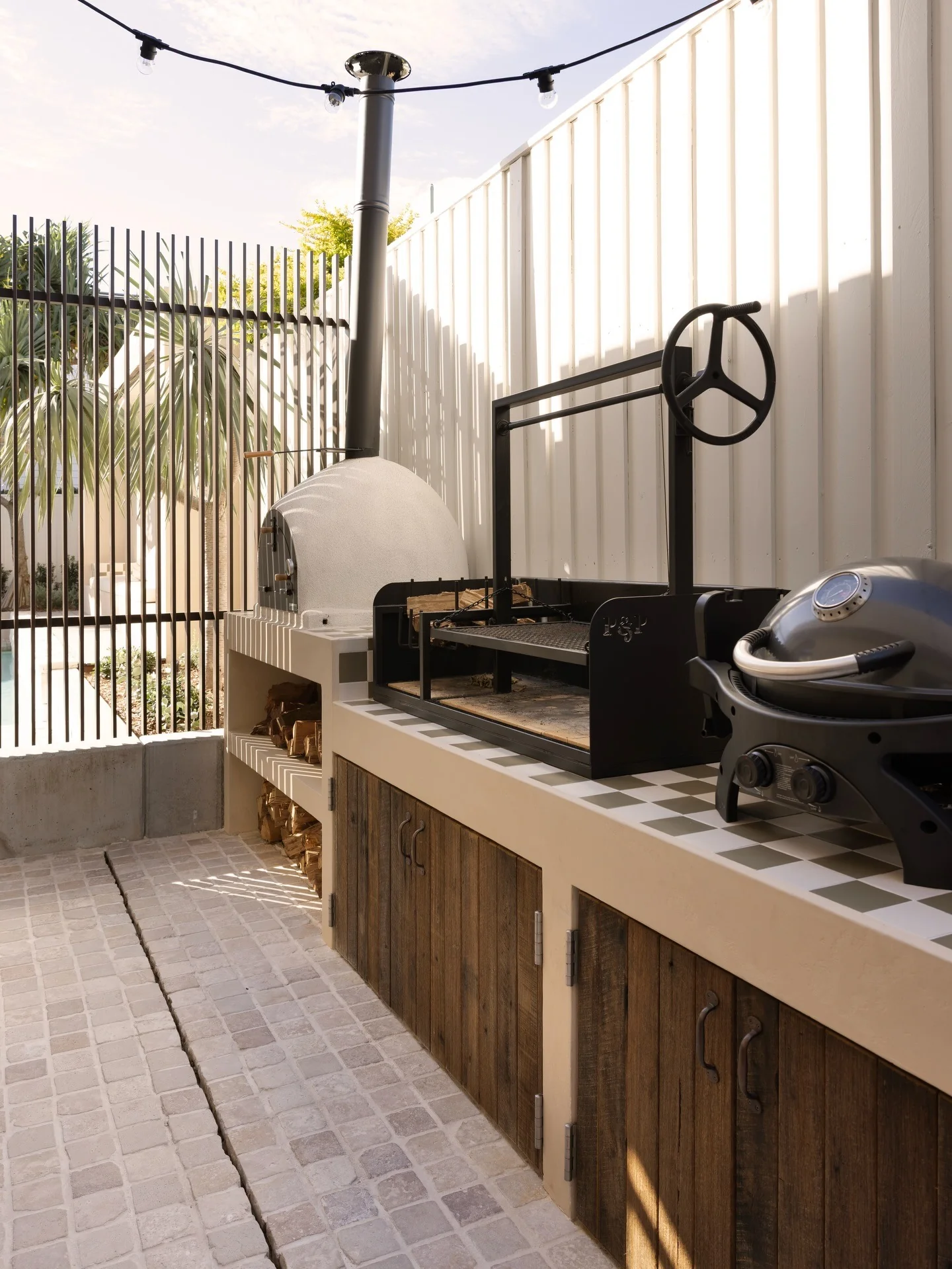 13. Compact Pizza Oven Setup in Cream, Black & Rustic Walnut (Small Outdoor Kitchen Ideas)