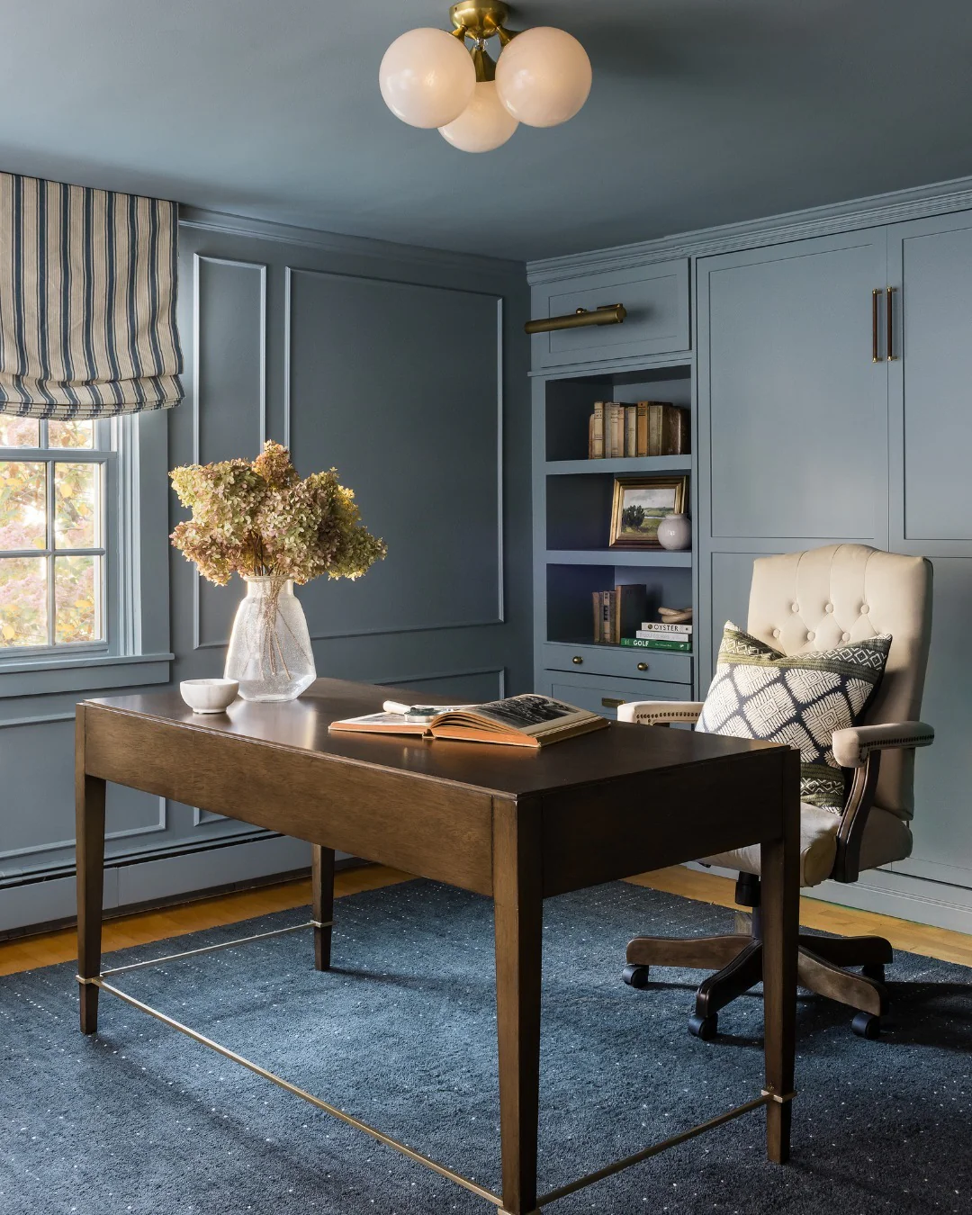 11. Moody Light Blue Office with Panel Molding and Warm Wood Desk (Light Blue Office Ideas)