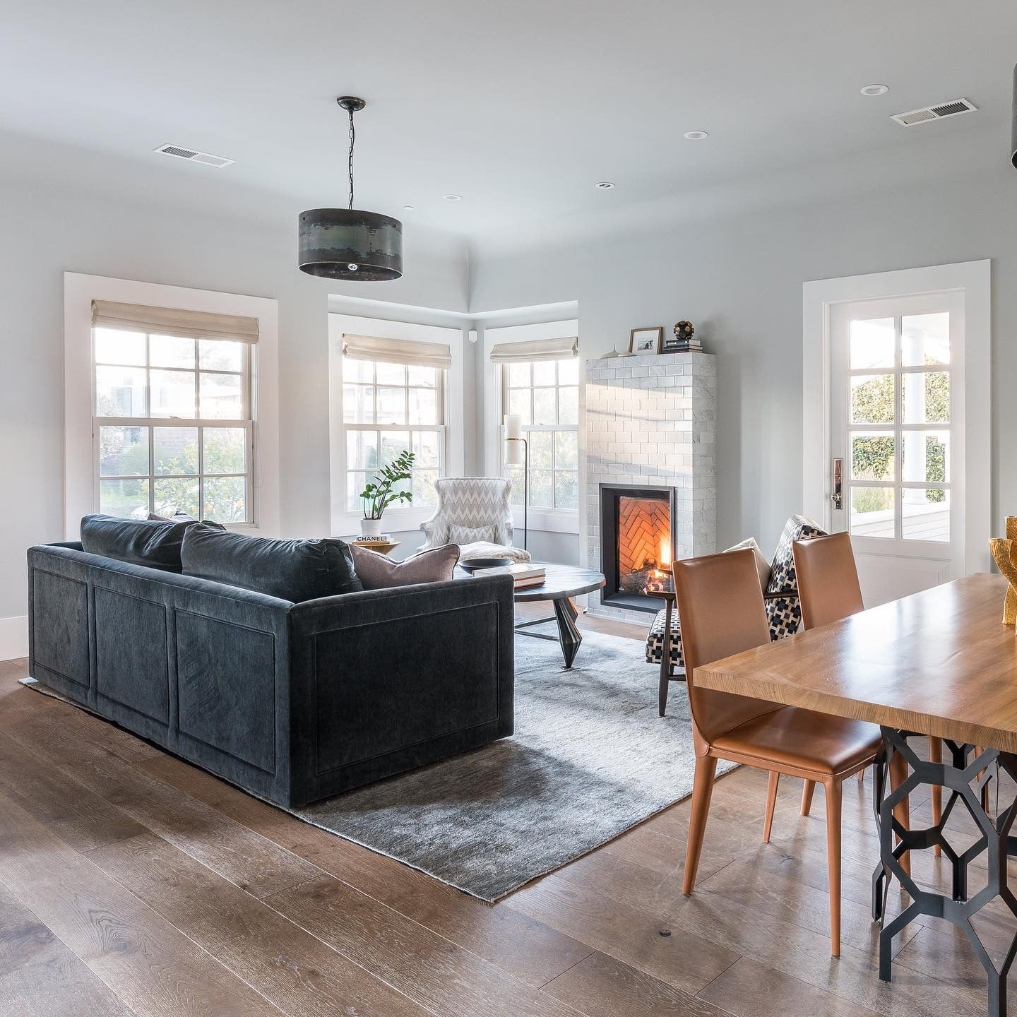 5. Deep Charcoal Sofa in an Open-Plan Grey & Wood Living Space (Dark Sofa Living Room Ideas)