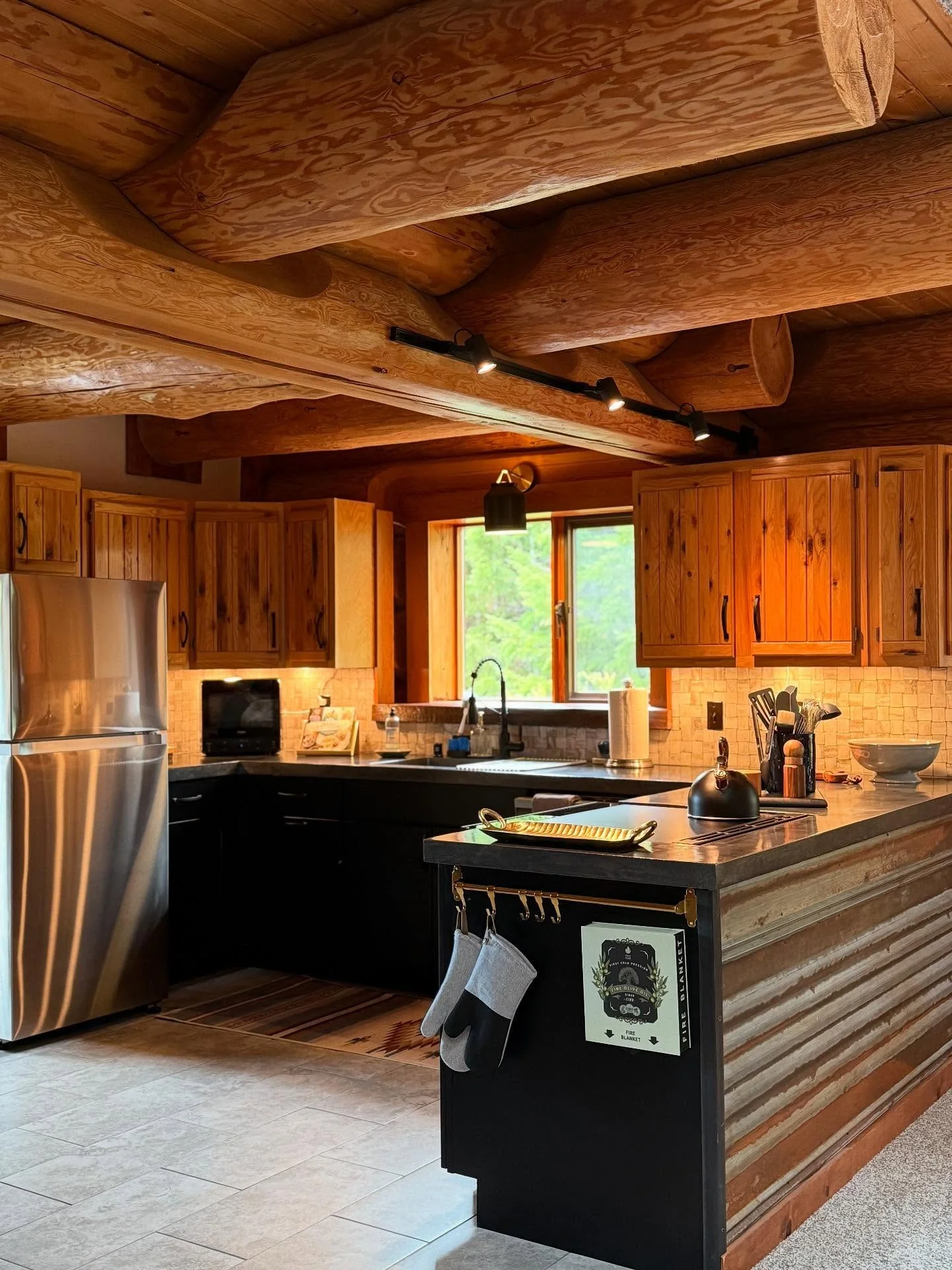 3. Natural Log Beam Kitchen with Mixed Wood Finishes (Log House Kitchen Ideas)