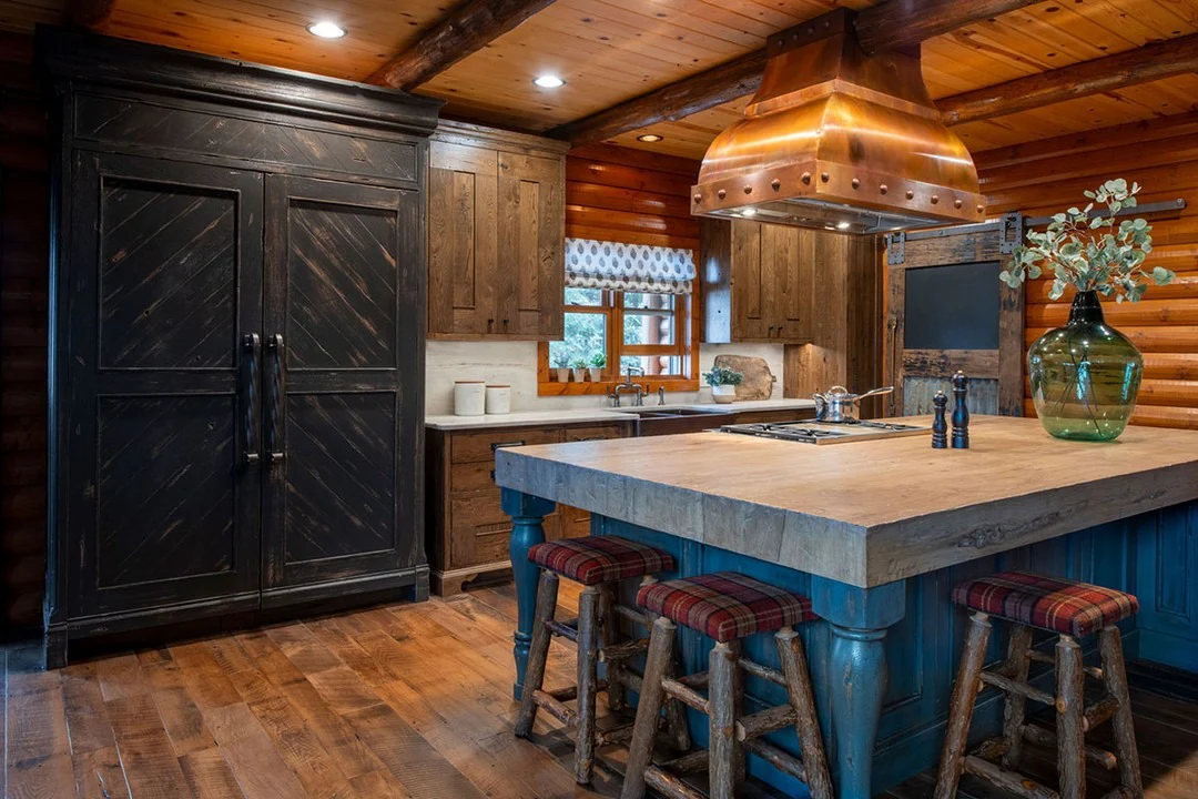 5. Rustic Lodge Kitchen with Copper Range Hood Accent (Log House Kitchen Ideas)
