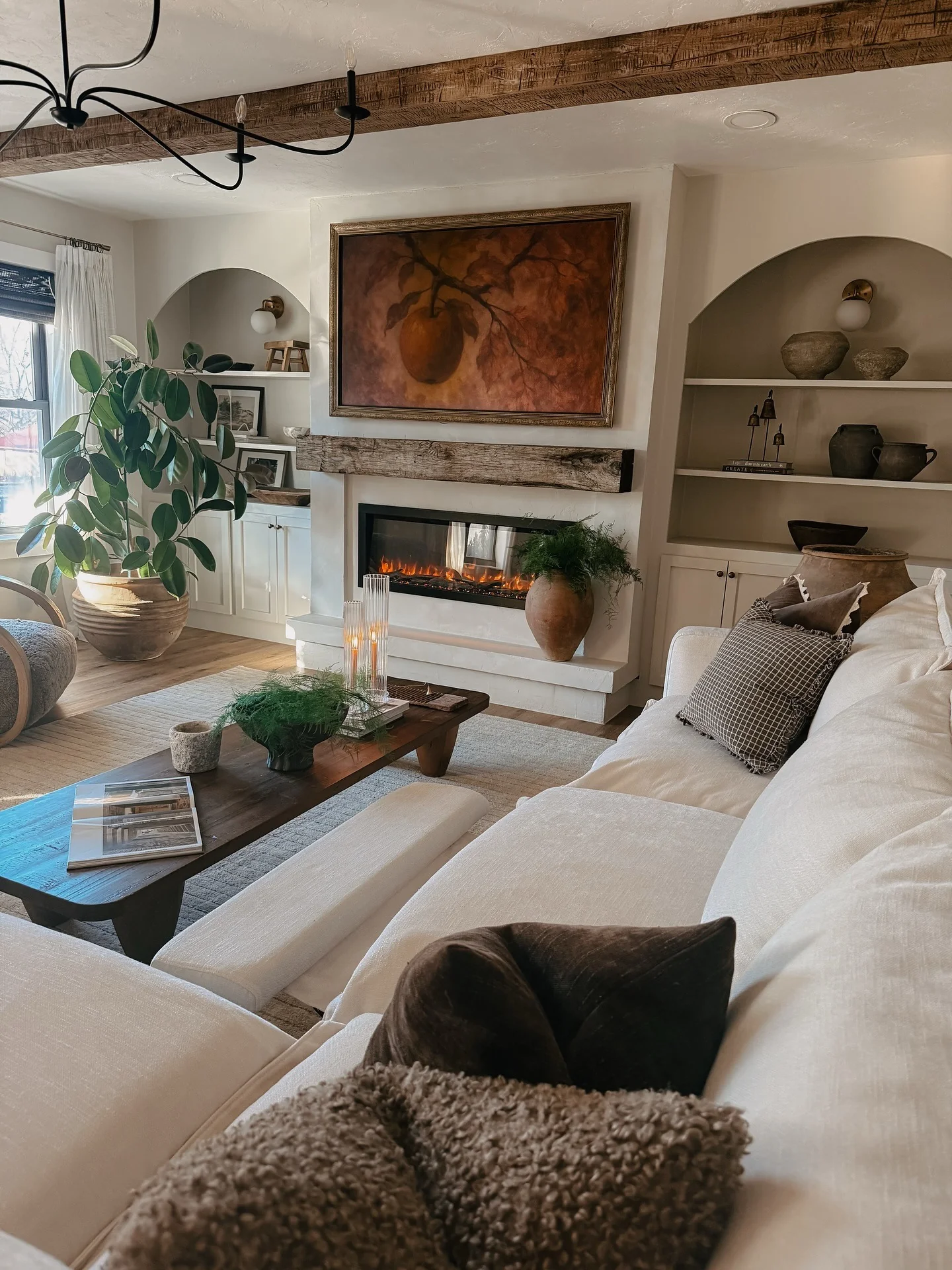 12. Rustic Beam Fireplace with Cream-and-Walnut Layers (Cream and Brown Living Room Ideas)