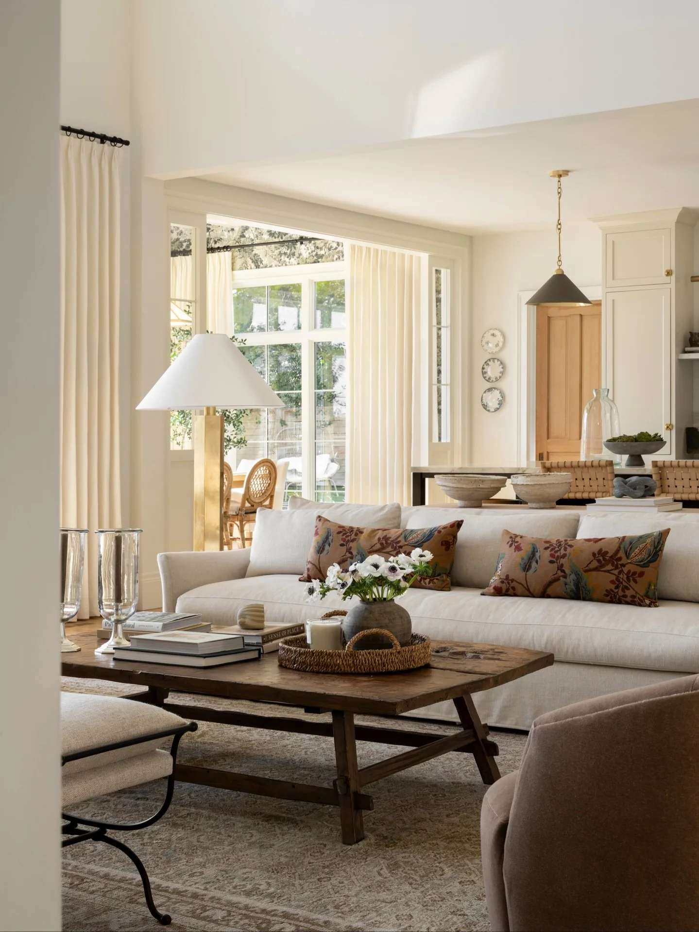 13. Bright Cream Living Room with Warm Brown Patterned Pillows (Cream and Brown Living Room Ideas)