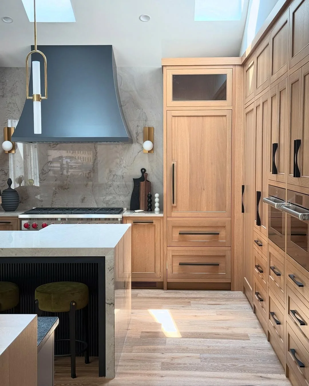 2. Statement Range Wall with Maple Cabinets + Marble Slab + Charcoal Hood (Maple Cabinet Kitchen Ideas)