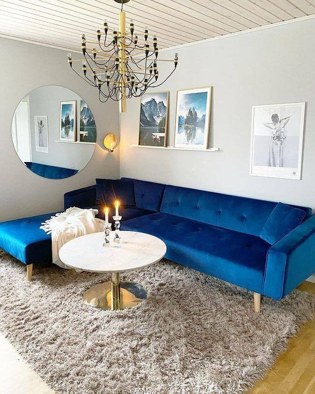 5. Scandinavian Chic Sectional with Royal Blue + Brass + Cream (Royal Blue Sofa Living Room Ideas)