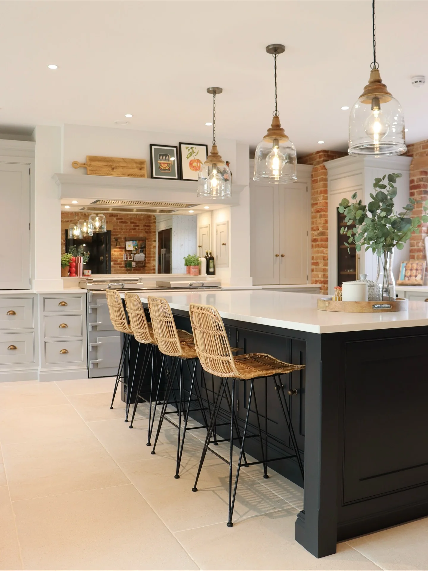 3. Black Island with Warm Wood and Brick Accents (Gray and Black Kitchen Ideas)