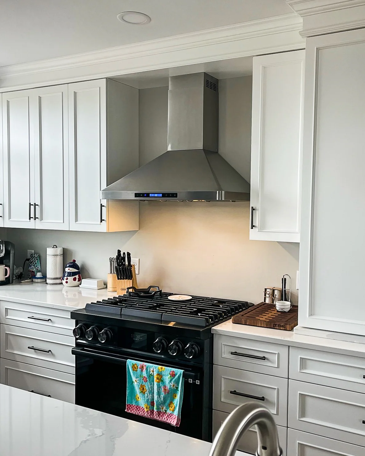 11. Soft Gray Cabinetry with Stainless Steel Statement Range (Gray and Black Kitchen Ideas)