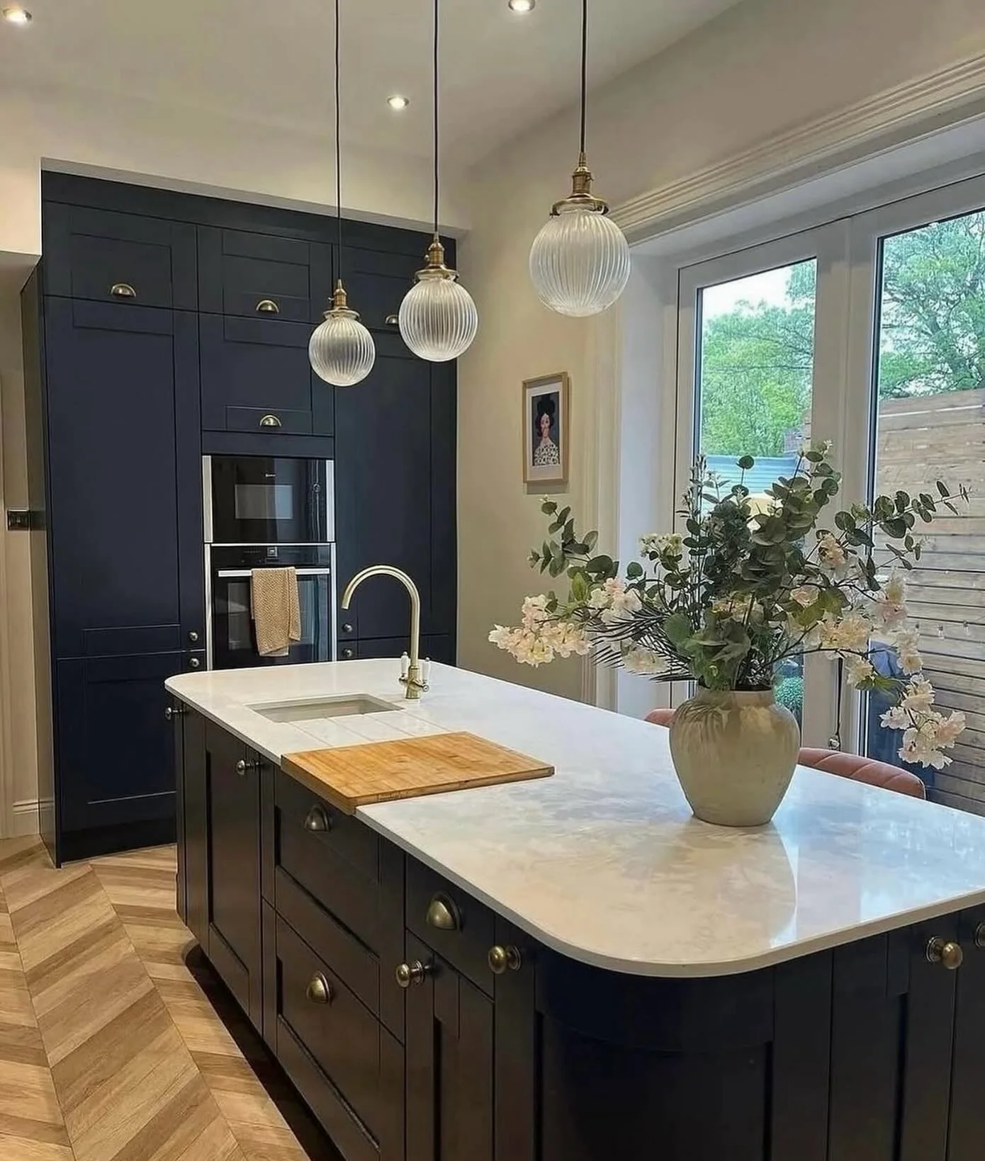 12. Black Island Kitchen with Brass and Glass Pendant Accents (Gray and Black Kitchen Ideas)