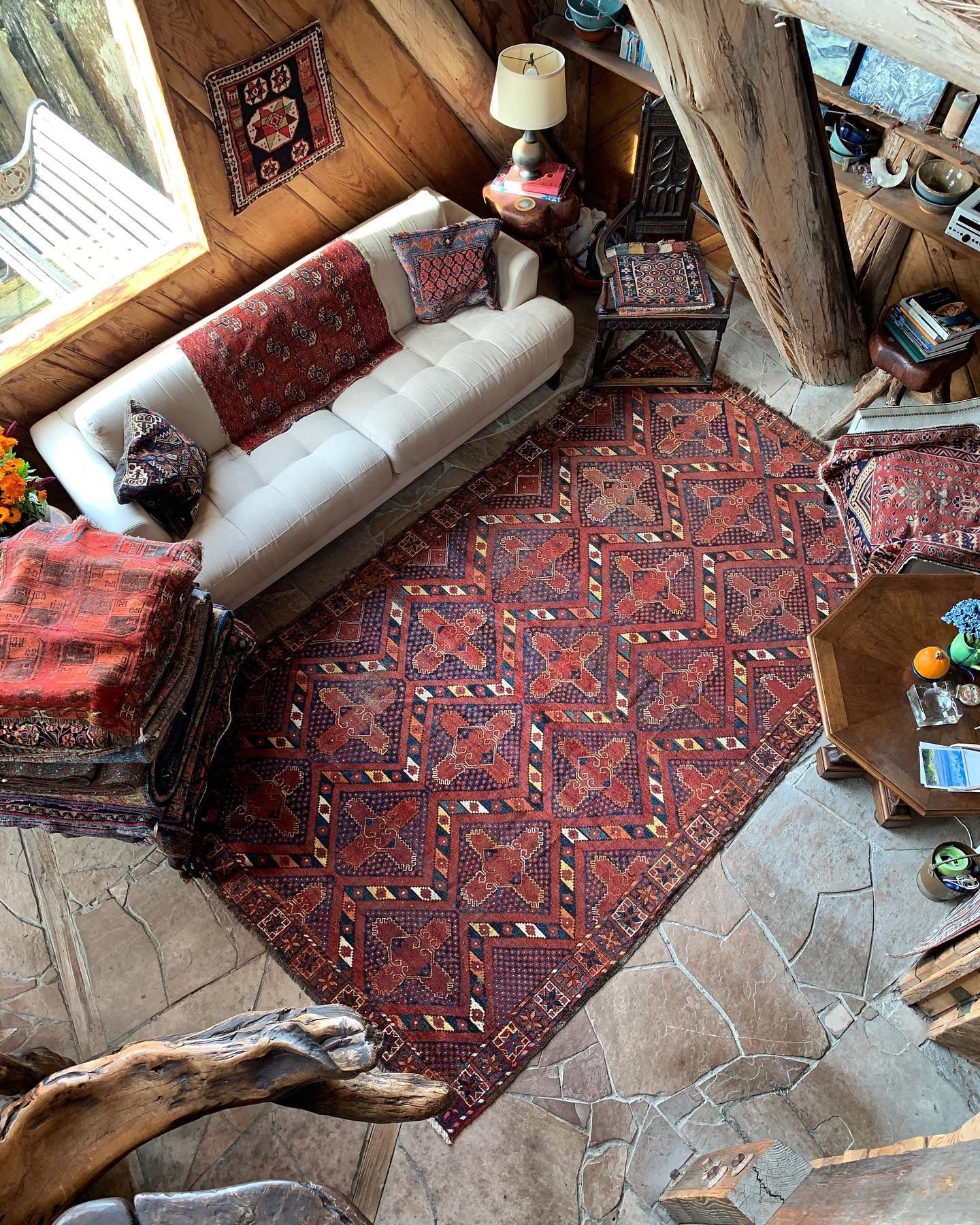 2. Collected Cabin Style in Earthy Reds and Cream (Rustic Living Room Design Ideas)