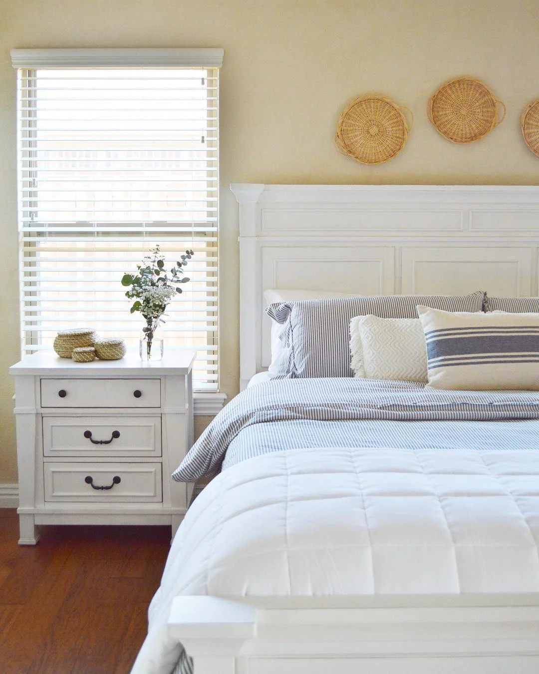 7. Classic White Bed Frame with Coastal-Inspired Details (White Furniture Bedroom Ideas)