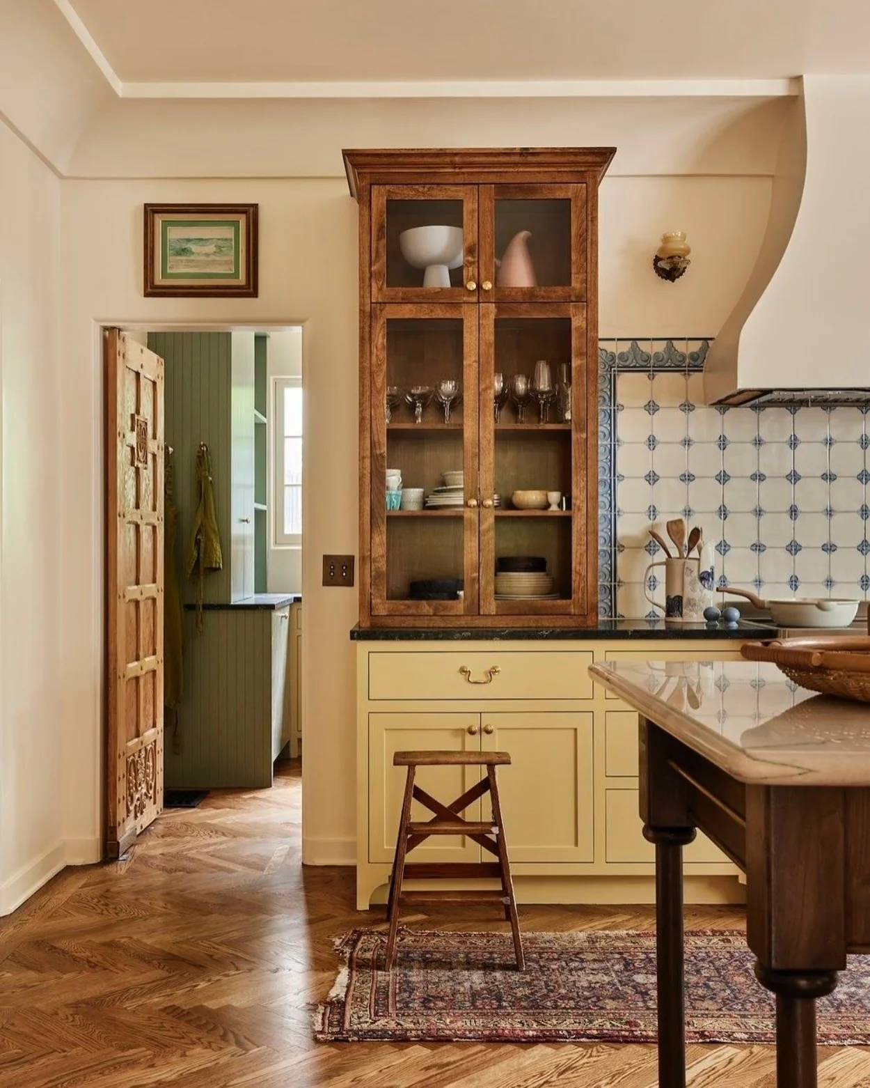 14. Spanish-Influenced Kitchen with Antique Wood Cabinetry (Spanish Style Kitchen Ideas)