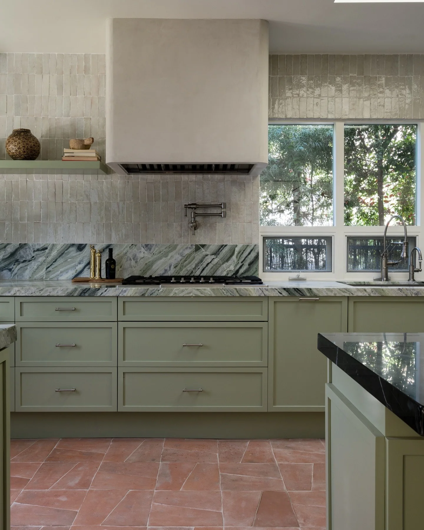 13. Soft Green Spanish Kitchen with Plaster Hood (Spanish Style Kitchen Ideas)