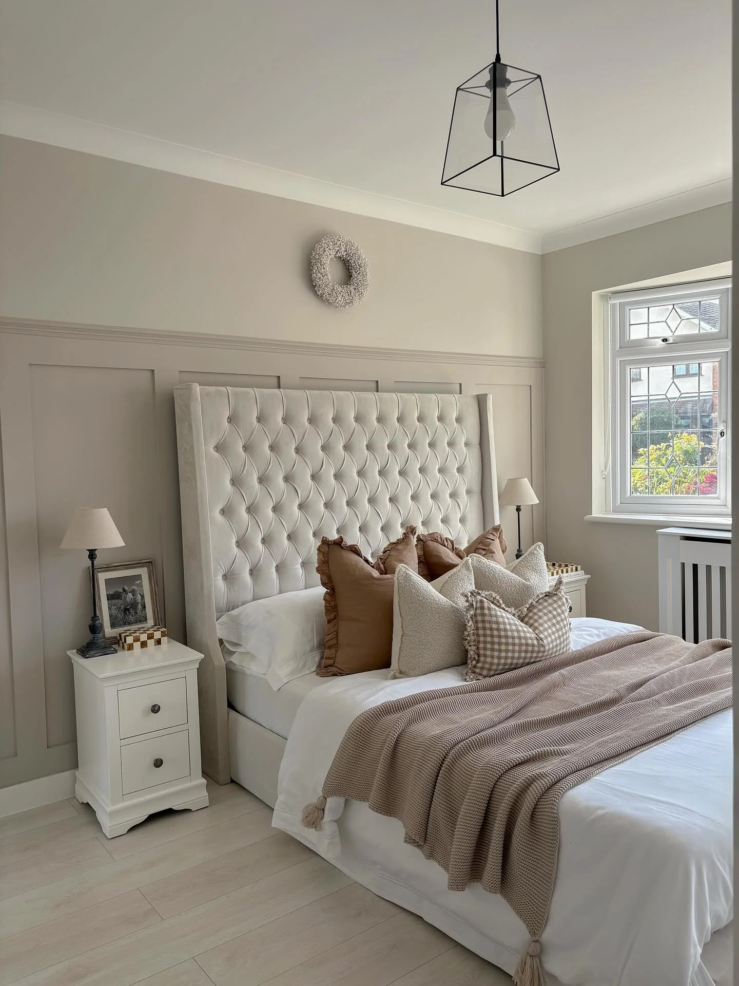 5. Light Greige Paneling with Elegant Symmetry (Accent Wall in Bedroom Ideas)