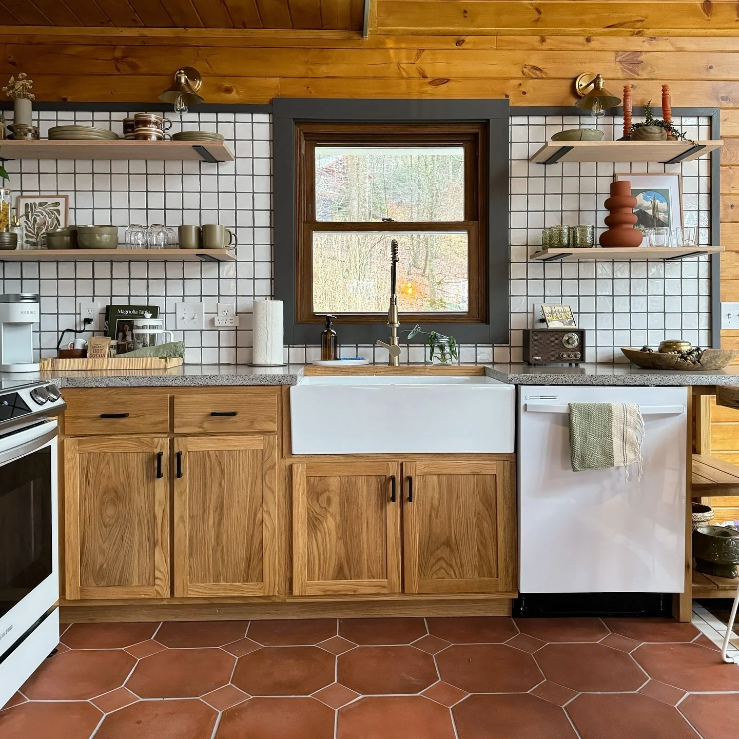 9. Modern Cabin Kitchen with Marble Waterfall Island (Cabin Kitchen Ideas)