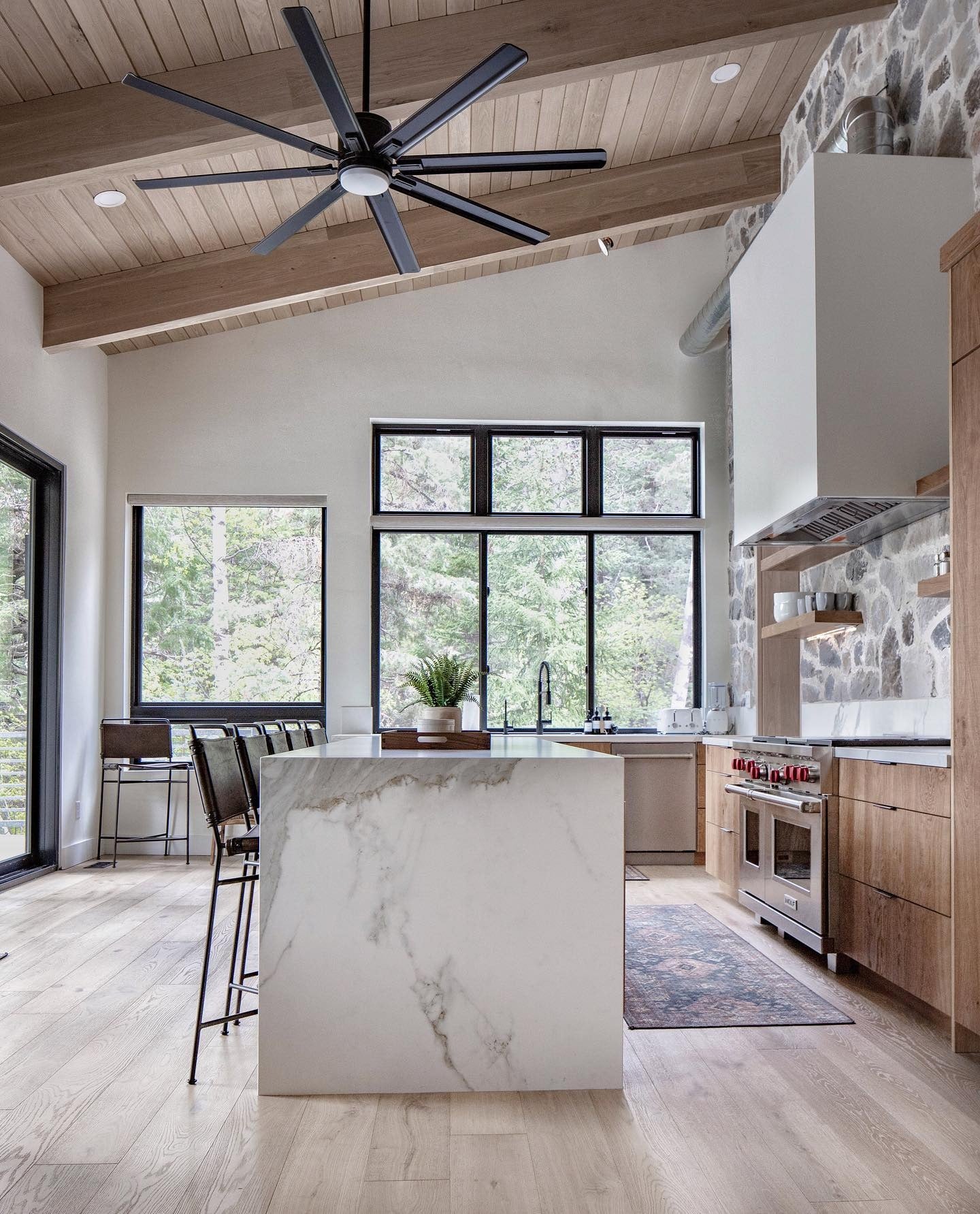 10. Wood-Wrapped Cabin Kitchen with Custom Range Alcove (Cabin Kitchen Ideas)