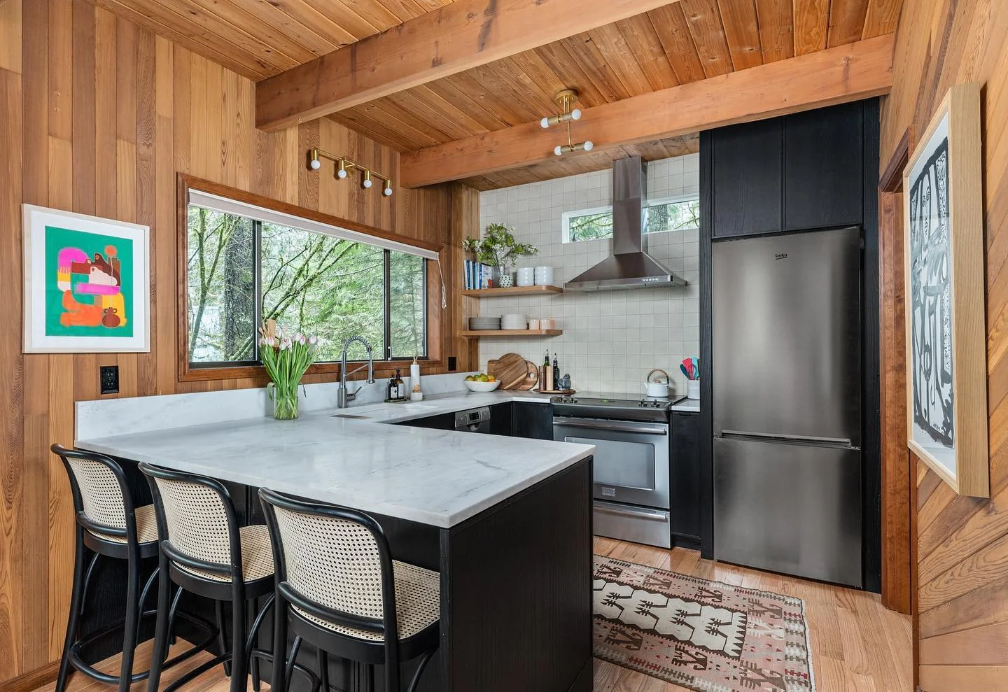 11. Modern Cabin Kitchen with Black Cabinetry and Warm Wood (Cabin Kitchen Ideas)