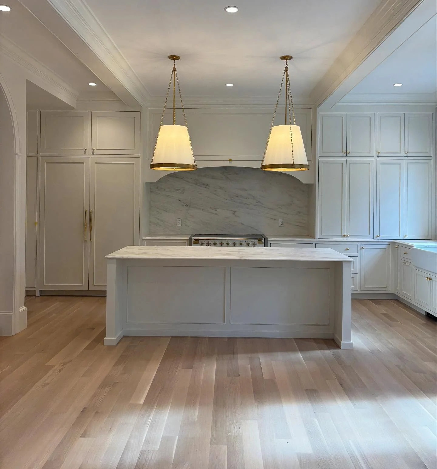 12. Cream Tall Cabinets with Symmetrical Island Design (Tall Kitchen Cabinets Ideas)