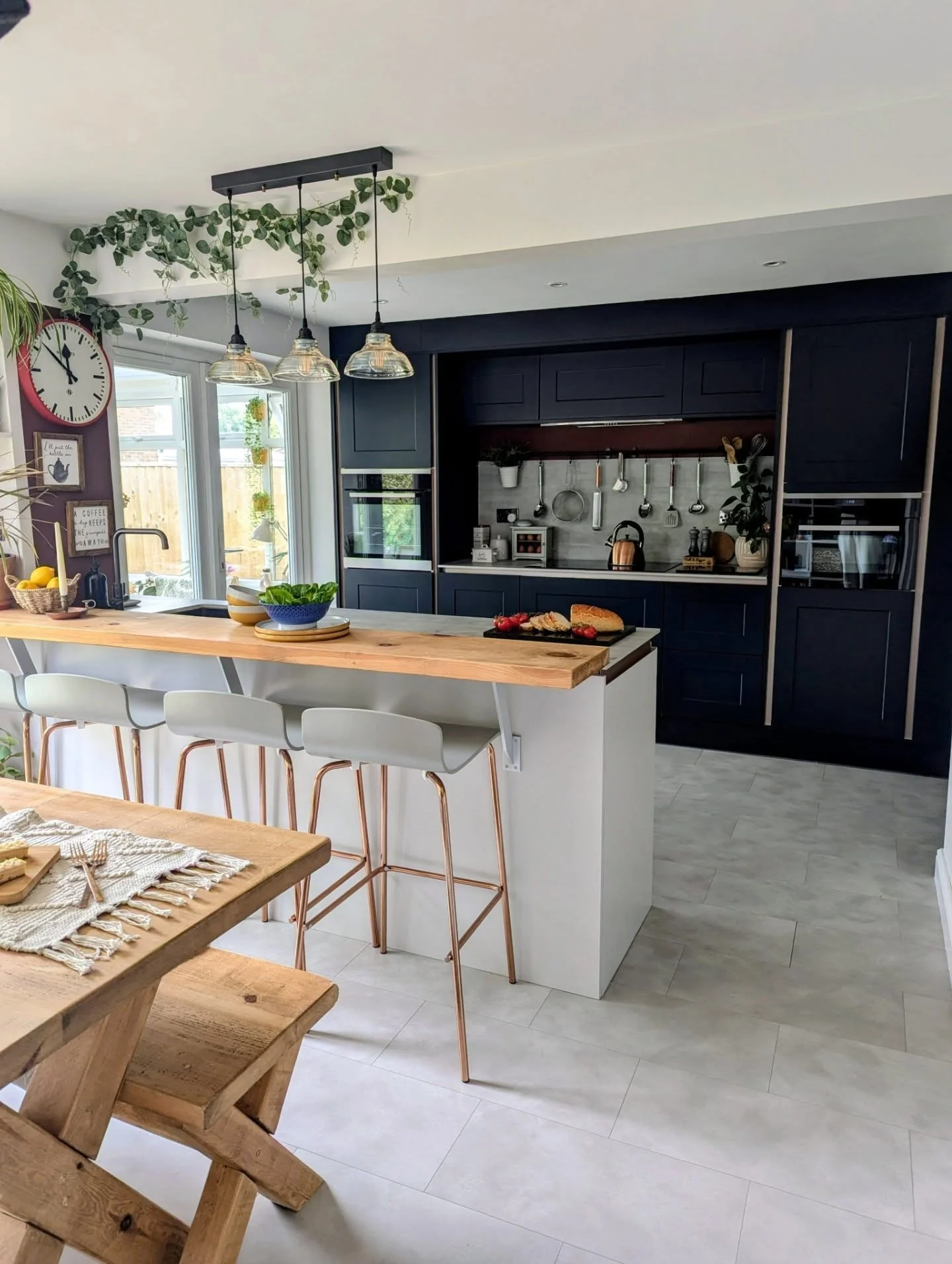 7. Light Grey Flooring with Navy and Warm Wood Accents (Grey Floor Kitchen Ideas)