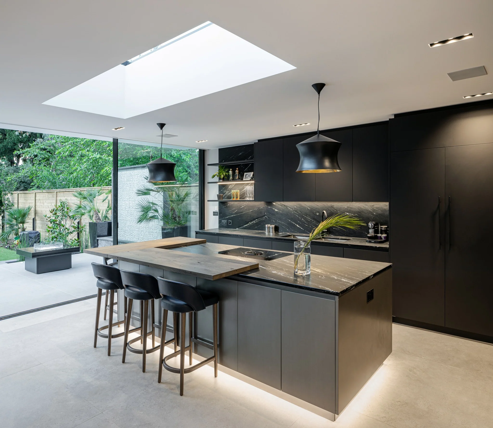 11. Dark Grey Flooring with Matte Black Modern Cabinetry (Grey Floor Kitchen Ideas)