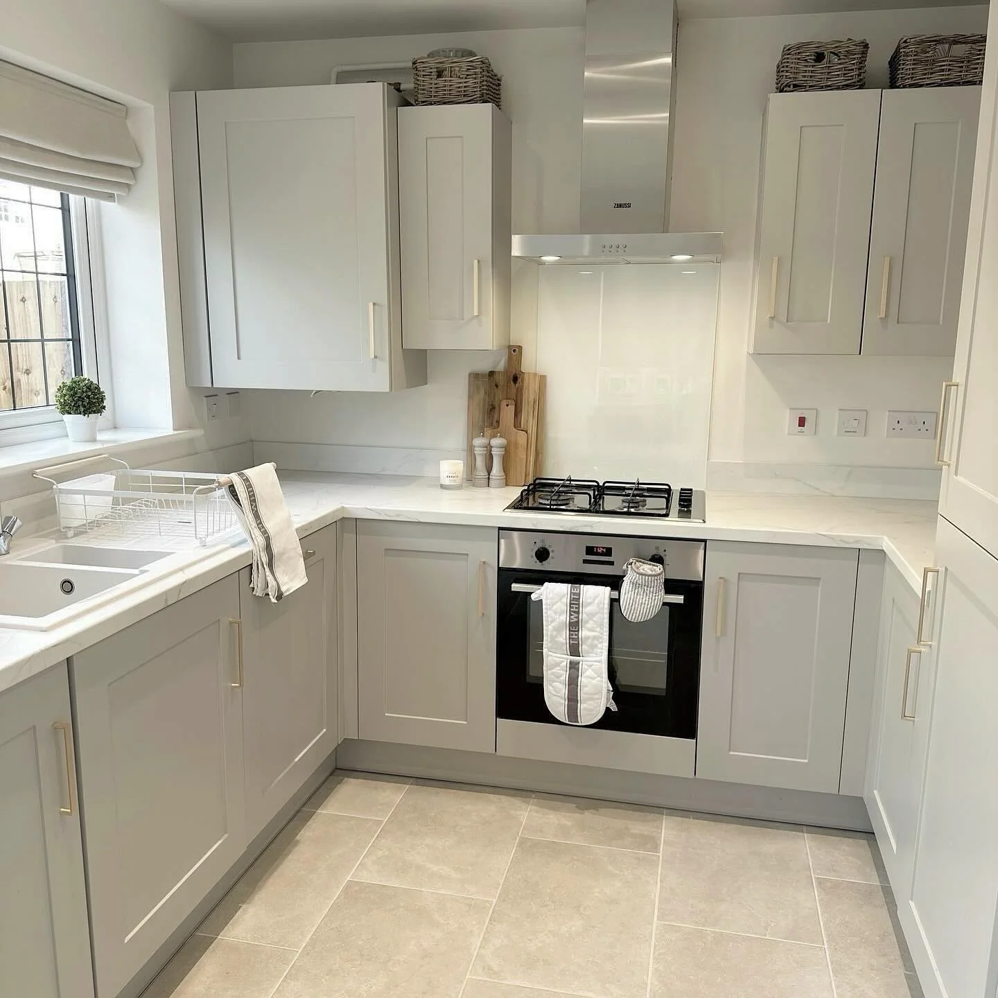 13. Warm Grey Tiles with Soft Greige Cabinetry (Grey Floor Kitchen Ideas)