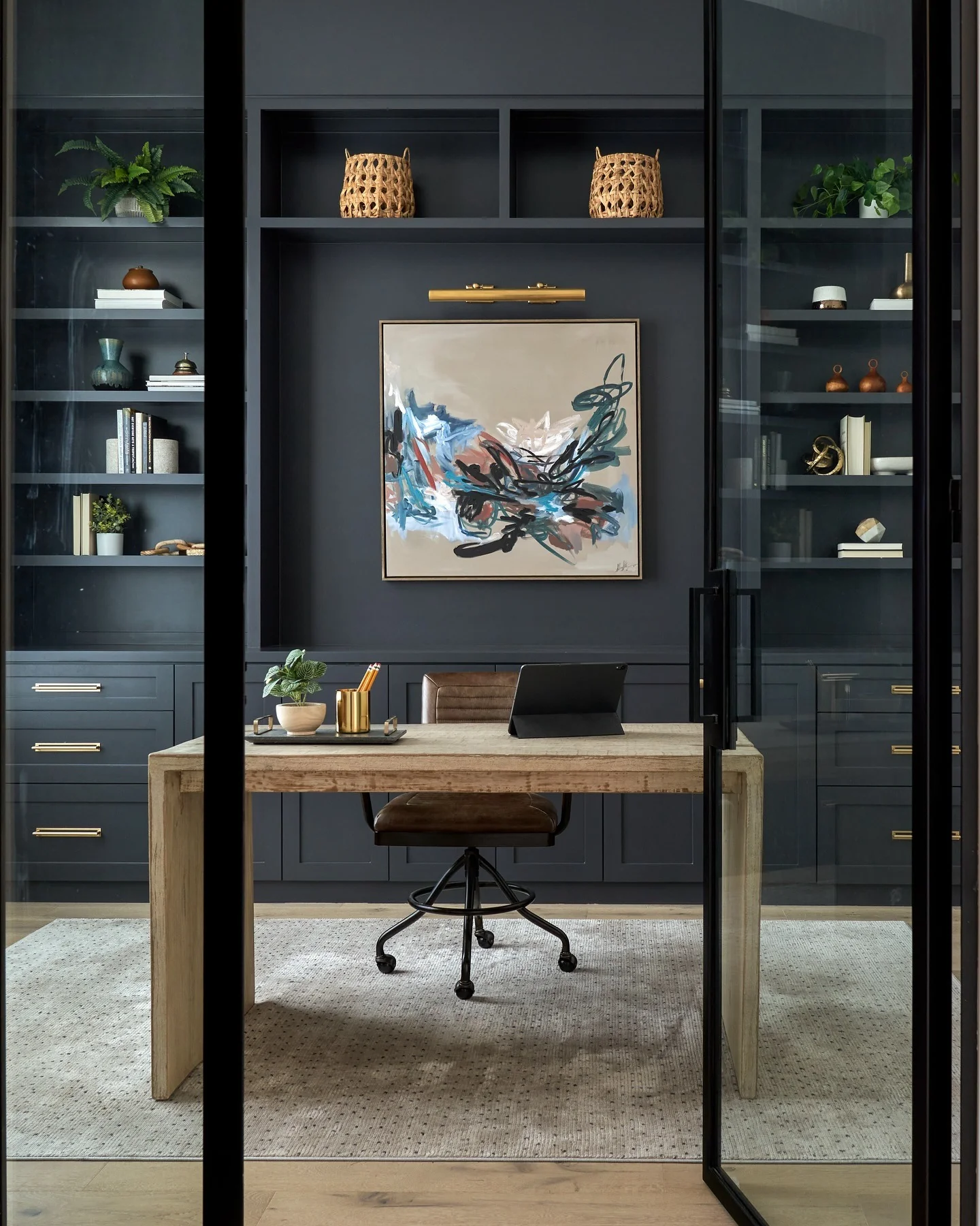 8. Glass-Enclosed Navy Office with Brass Details (Moody Office Ideas)