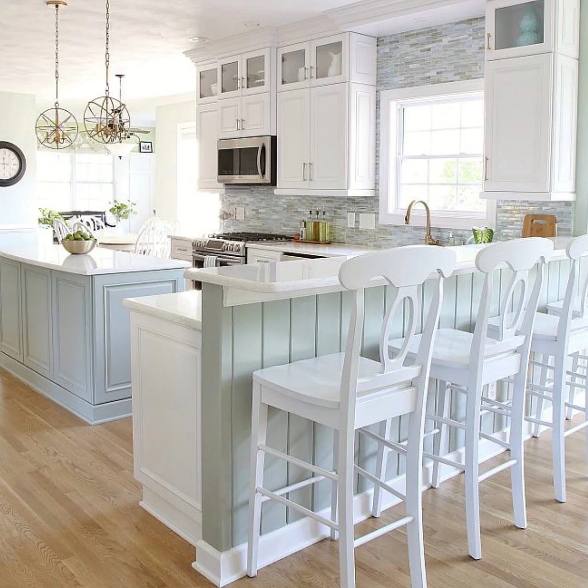 8. Powder Blue Island with Copper Pendant Accents (Coastal Kitchen Ideas)