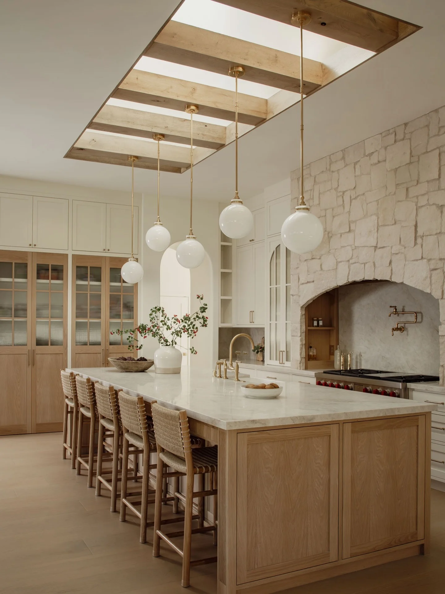 5. Warm Wood and White Kitchen with Architectural Arches (High Ceiling Kitchen Ideas)