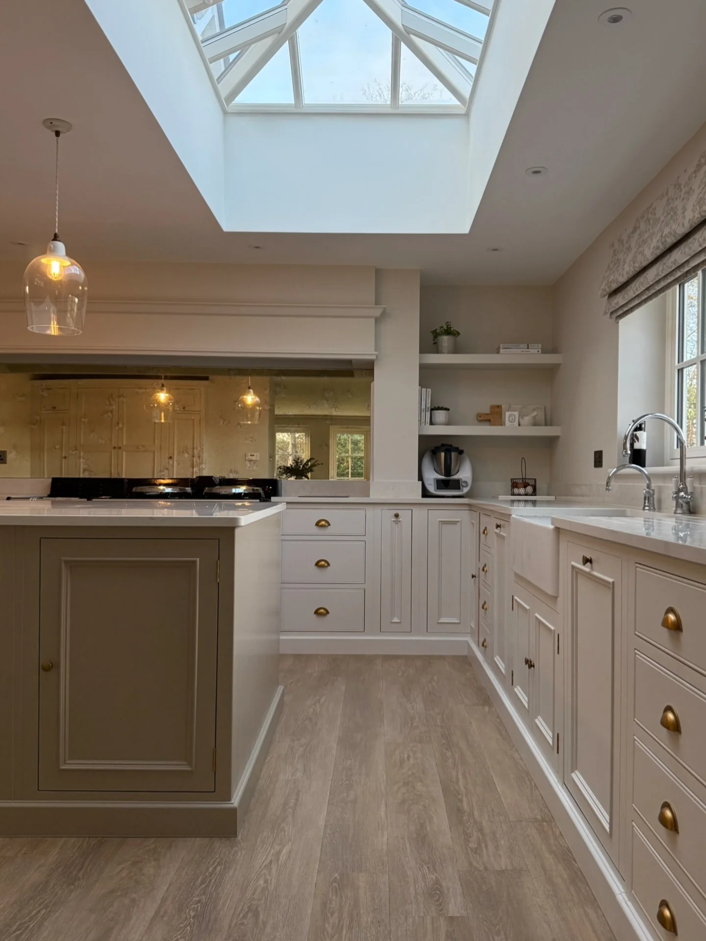 12. Soft Taupe Kitchen with Central Skylight Focus (High Ceiling Kitchen Ideas)