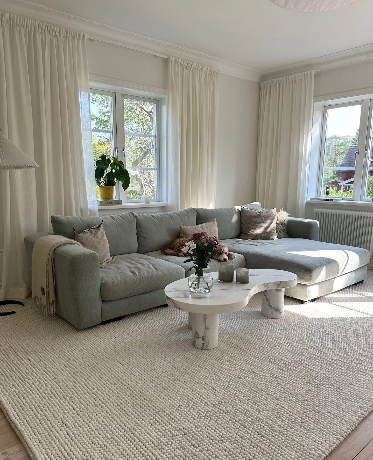 13. Airy Grey Sectional in a Light-Filled Living Room (Grey Sofa Living Room Ideas)
