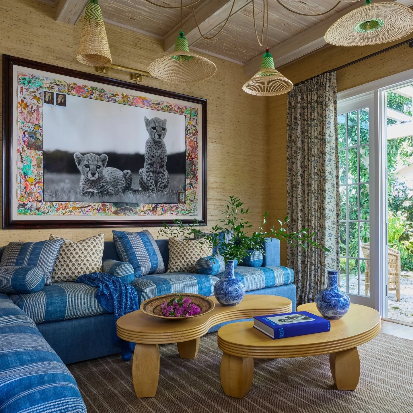 4. Layered Blues with Woven Lighting Accents (Beach Living Room Ideas)