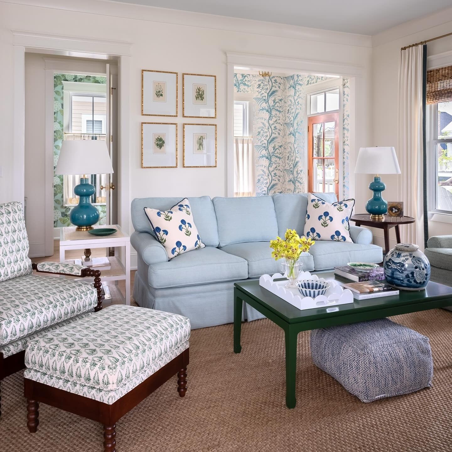 6. Soft Blue Sofa with Botanical Details (Beach Living Room Ideas)