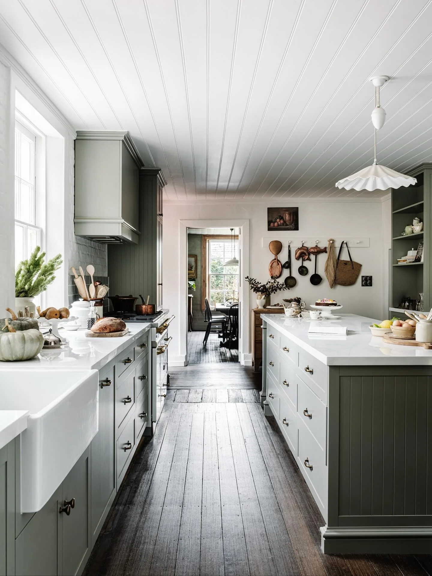 5. Traditional Sage Kitchen with Central Island (Long Narrow Kitchen Ideas)