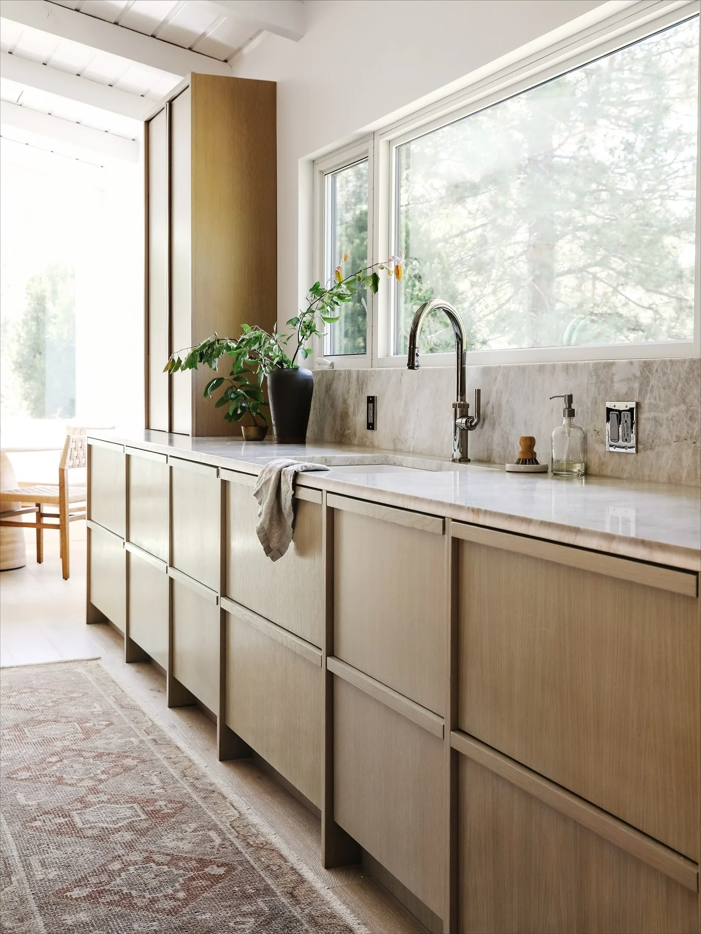 3. Light Wood Minimal Kitchen with Seamless Storage (Long Narrow Kitchen Ideas)