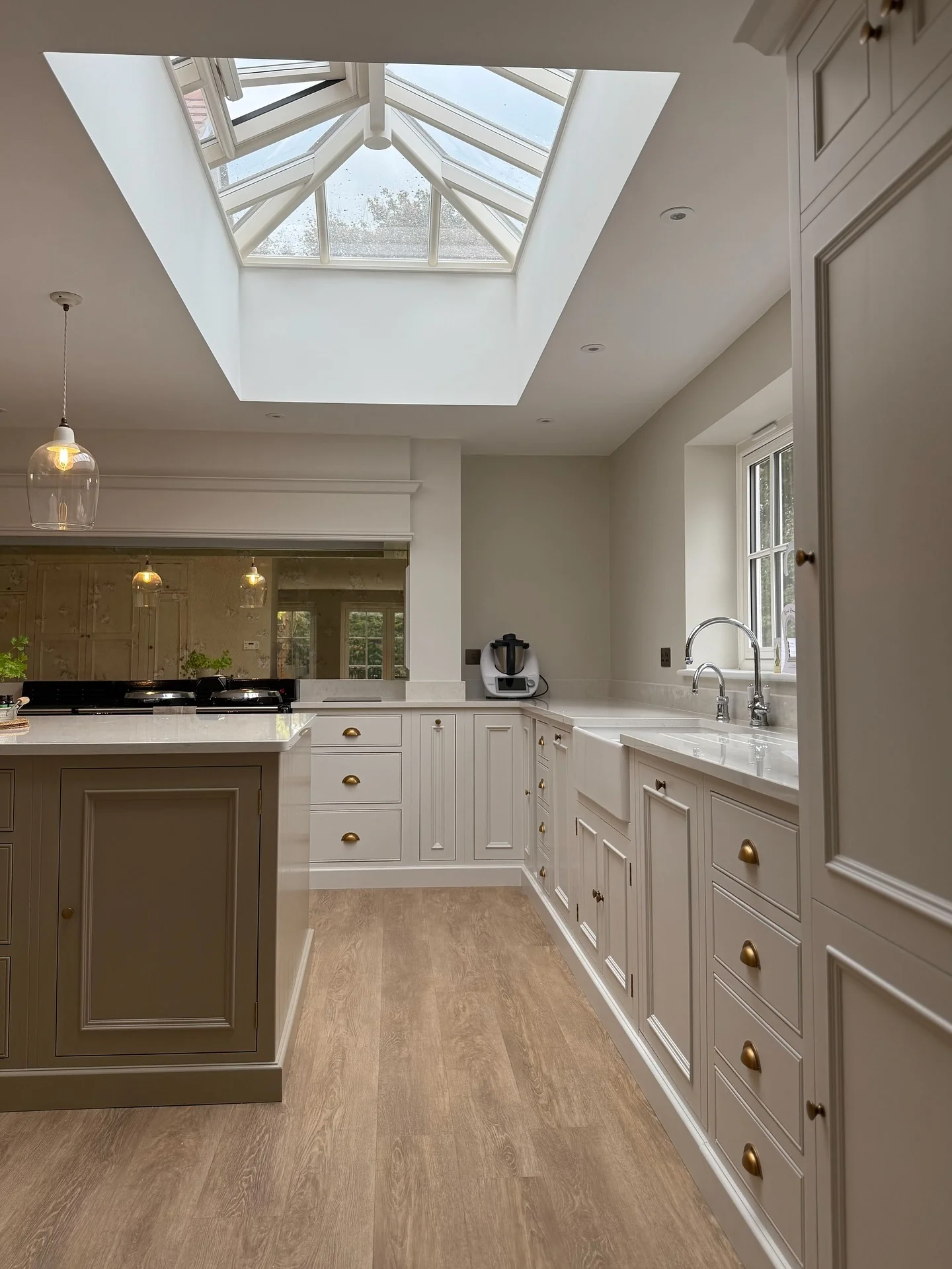 6. Neutral Skylight Kitchen with Tall Cabinetry (Long Narrow Kitchen Ideas)