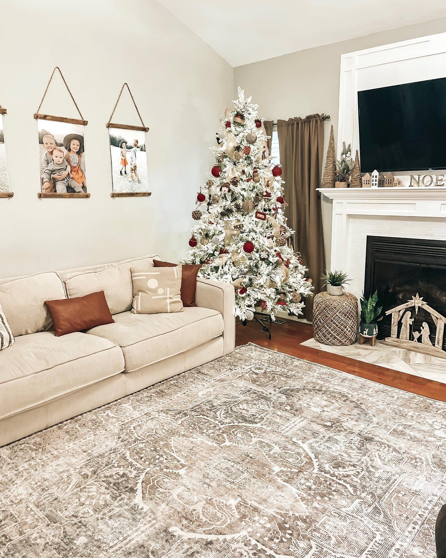 9. Warm Neutral Rug Supporting Seasonal Decor (Living Room Rug Ideas)